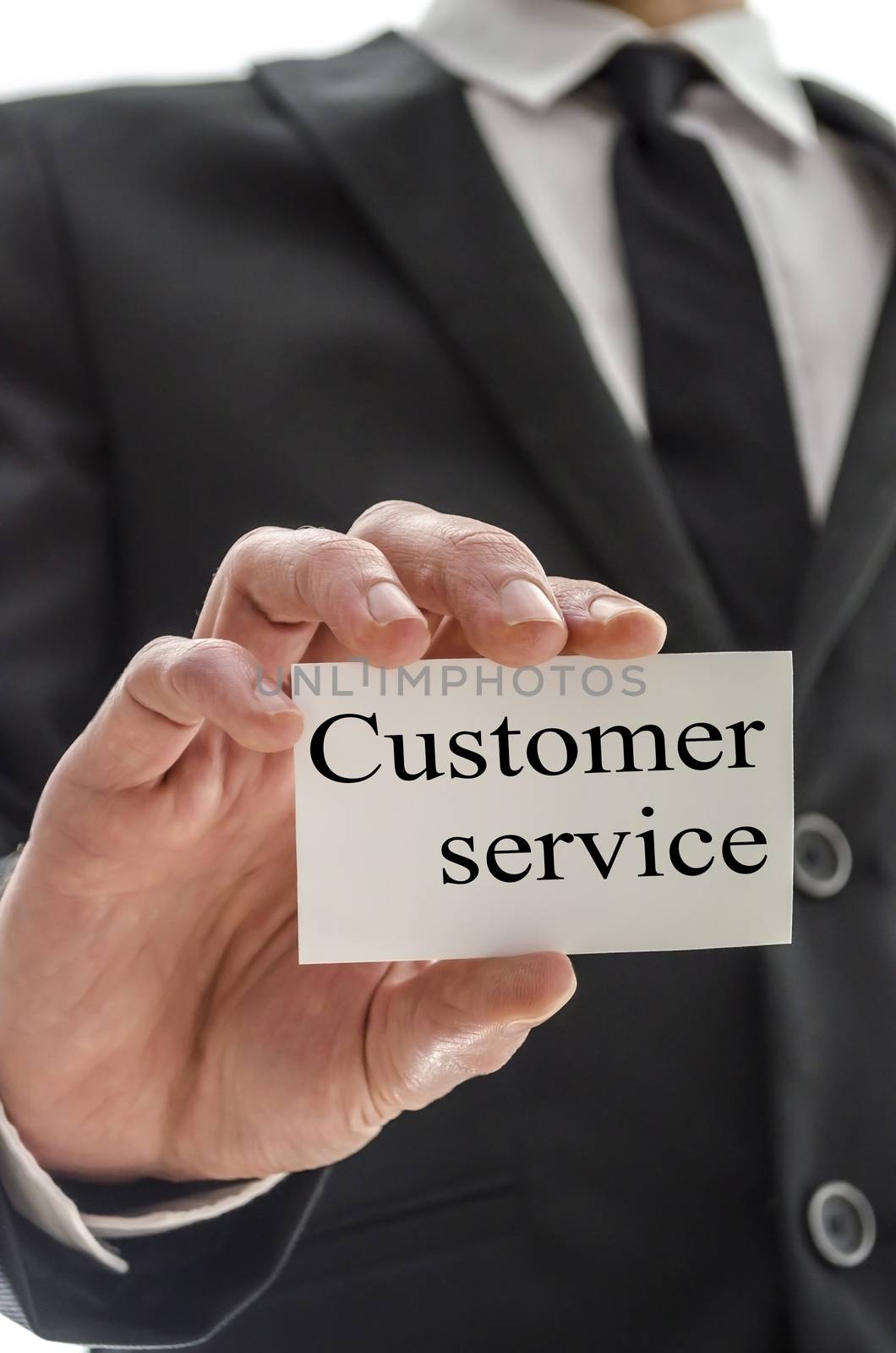 Business man holding card with customer service written on it.
