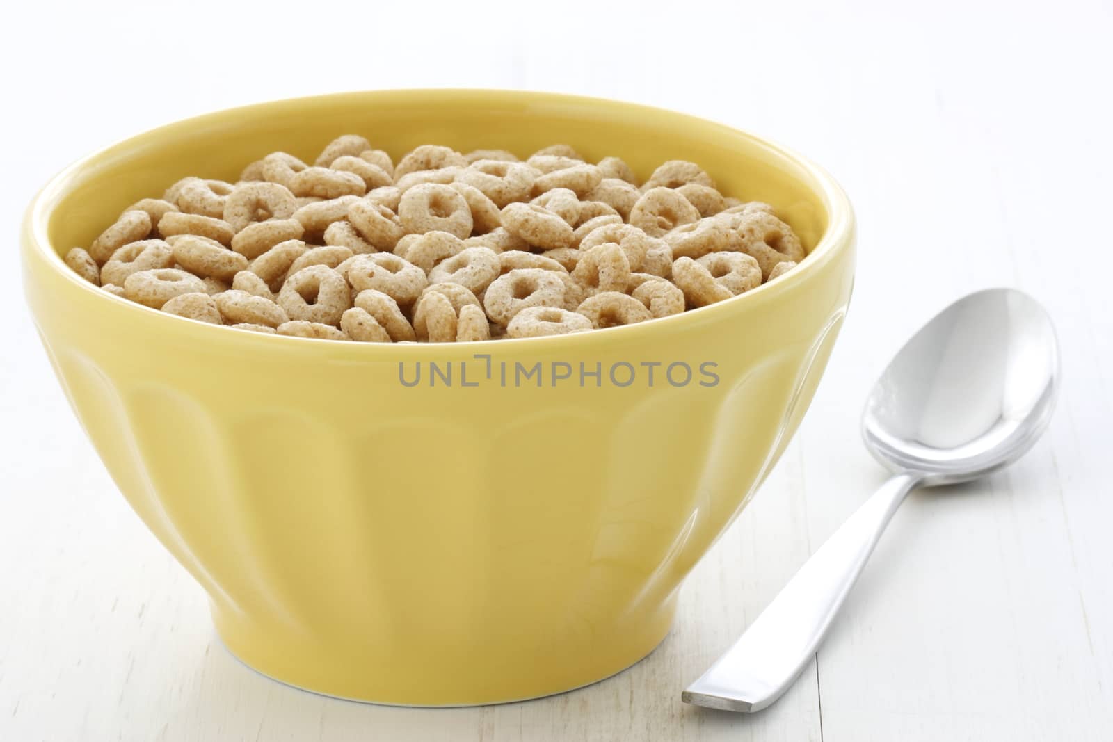 Delicious and nutritious lightly toasted honey, nuts and oats cereal with milk.