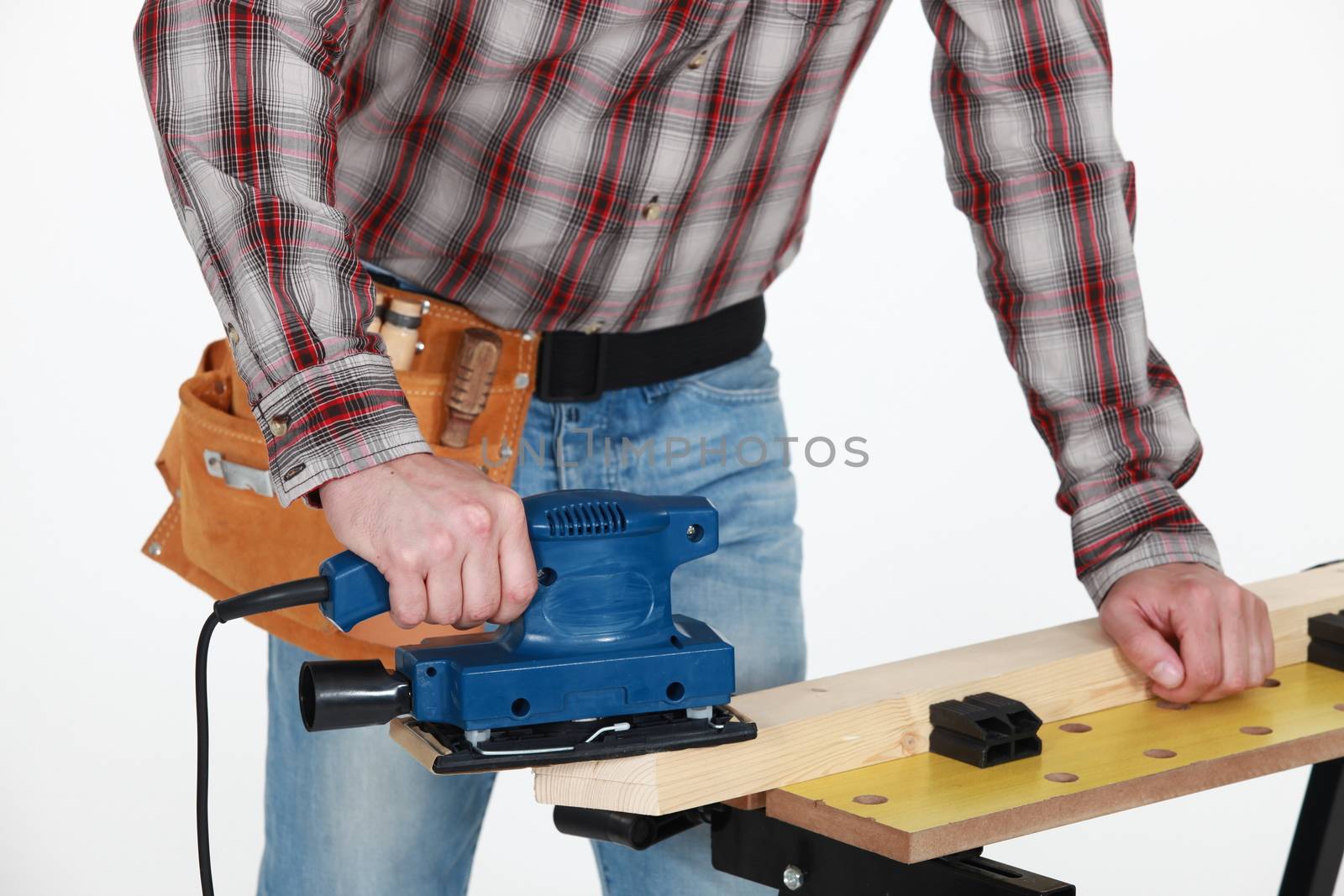 Man using a jigsaw by phovoir