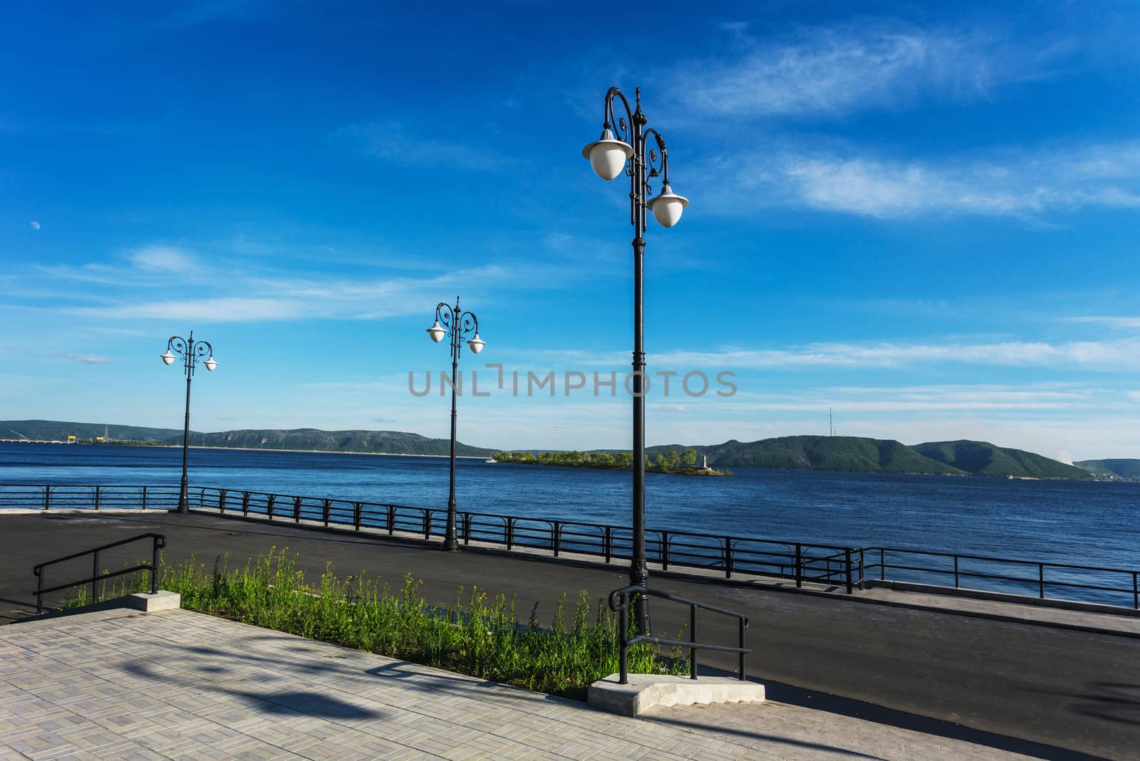 Street lights on the promenade on the shore of the great river