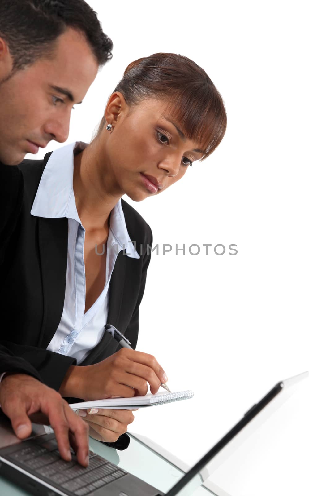 Business couple with a laptop by phovoir