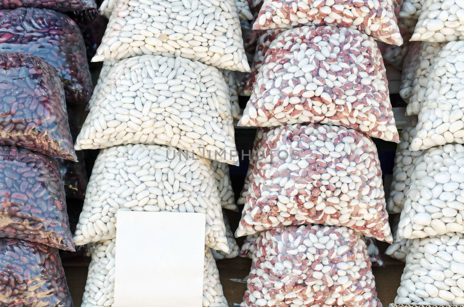 Common Beans Packages with Blank Price Tag on the Farmers Market, horizontal shot