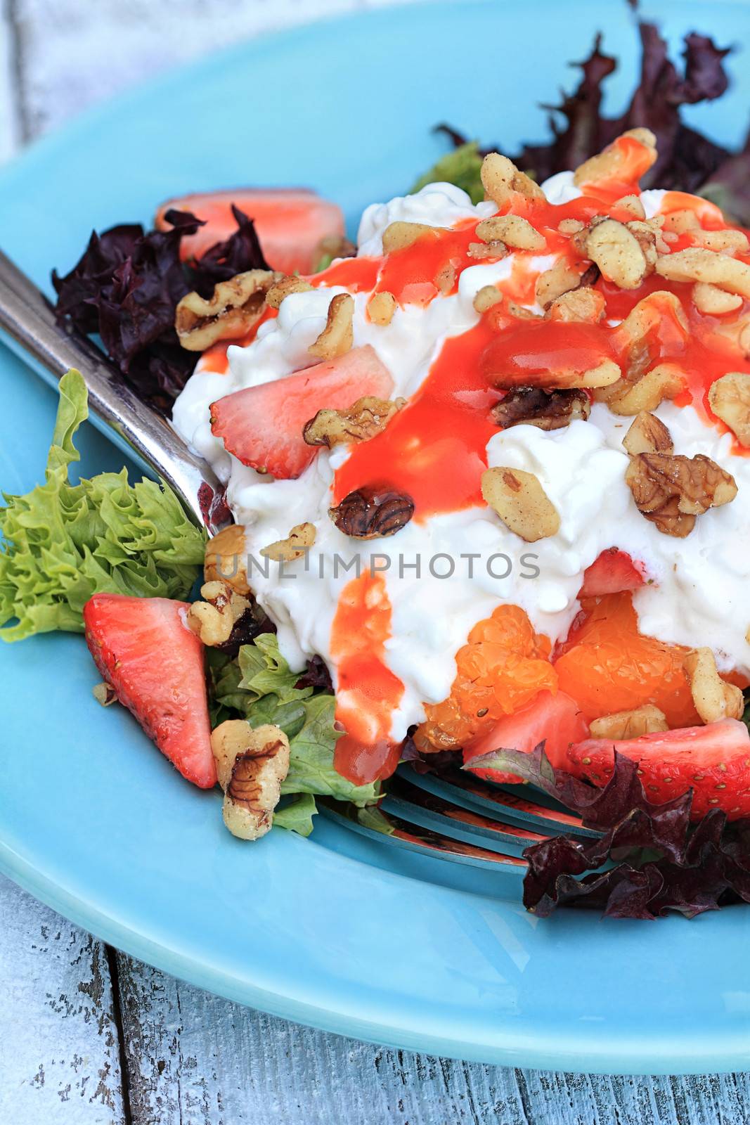 Strawberry and cottage cheese salad with french salad dressing. 