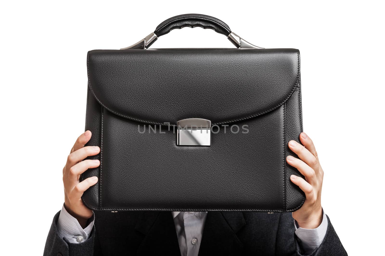 Businessman hand holding briefcase by ia_64