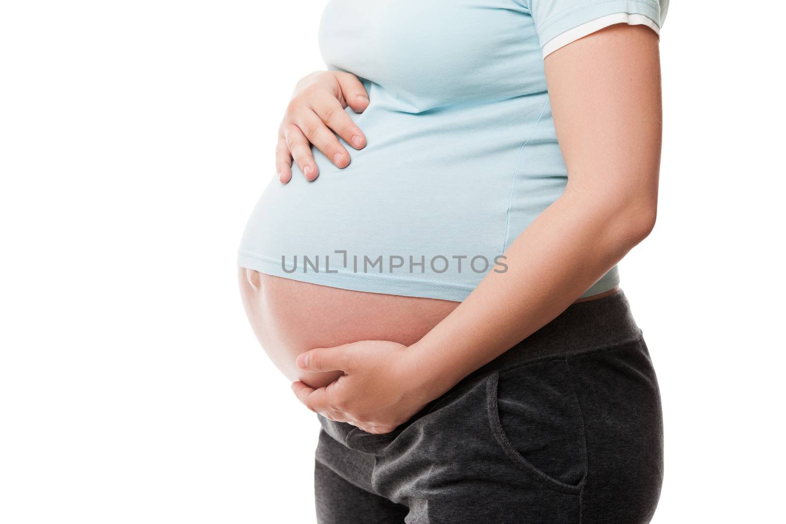 Pregnant woman touching or bonding her abdomen by ia_64