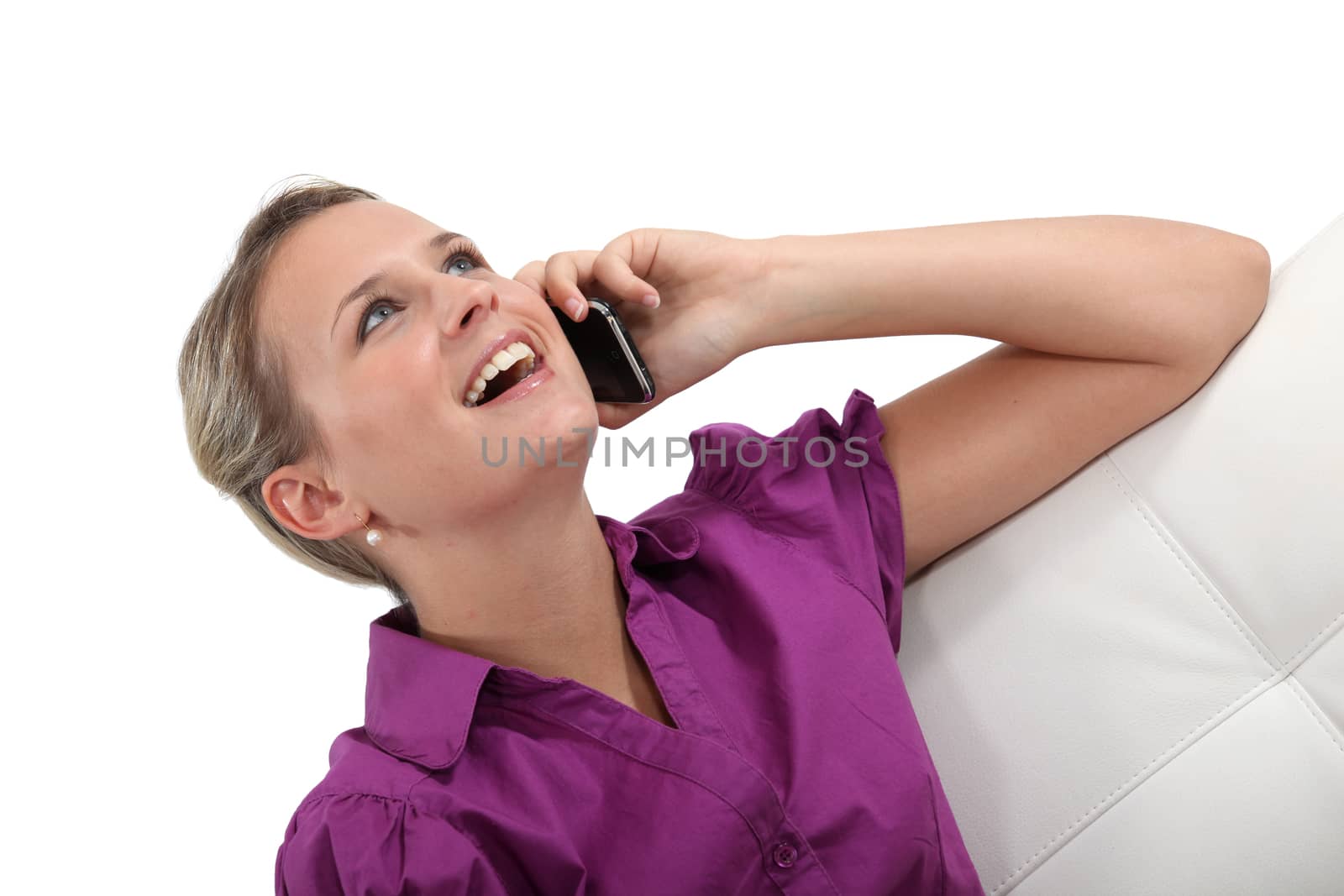 Woman laughing on the phone by phovoir