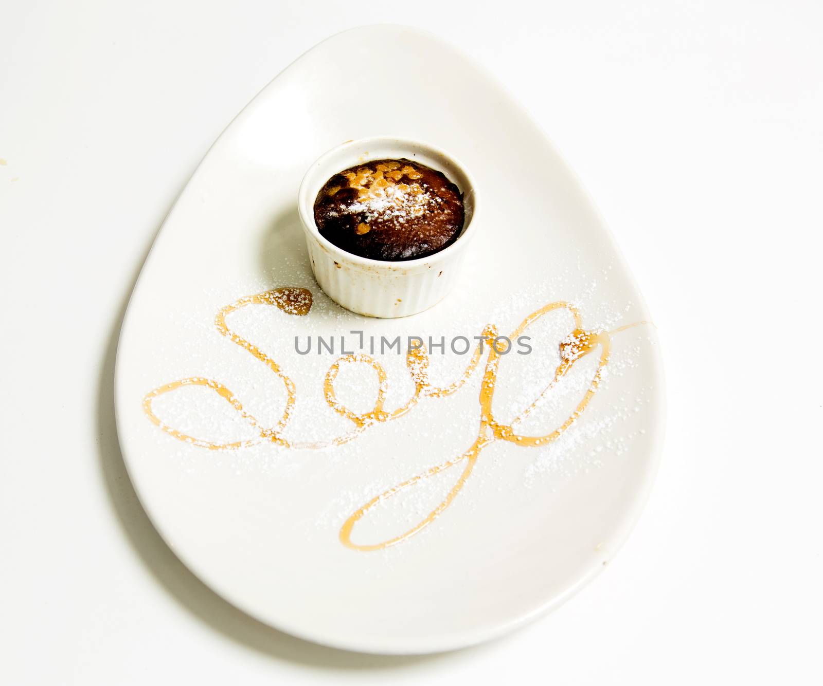 Soya Sauce in a cup placed over an oval plate