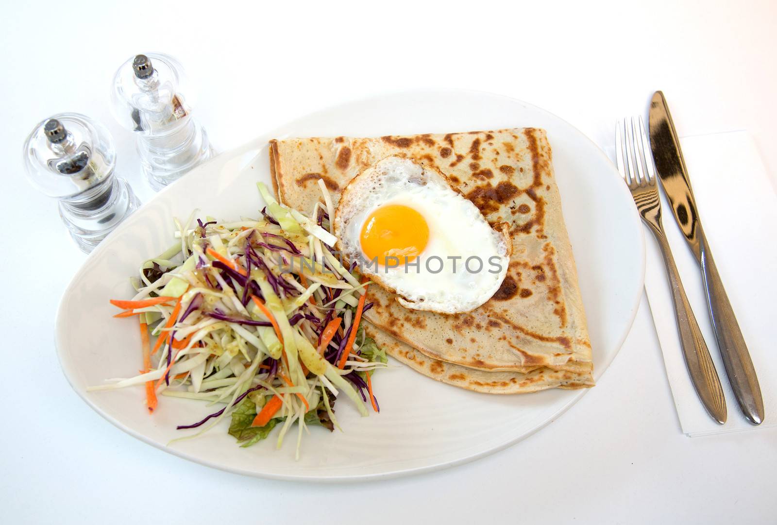 Fried eggs with coleslaw served for delicious brunch