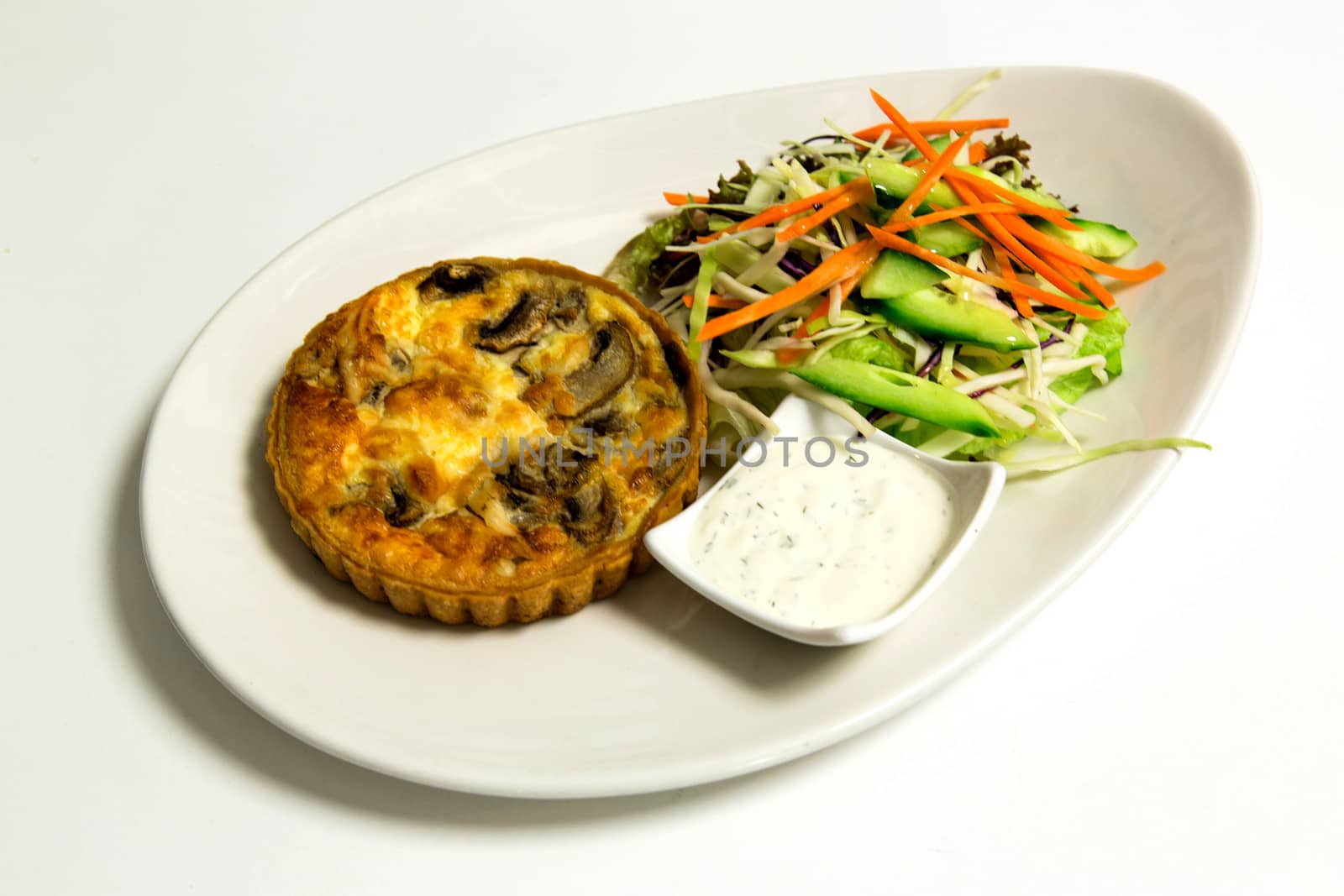 Pie, chopped vegetables salad and mayonnaise sauce