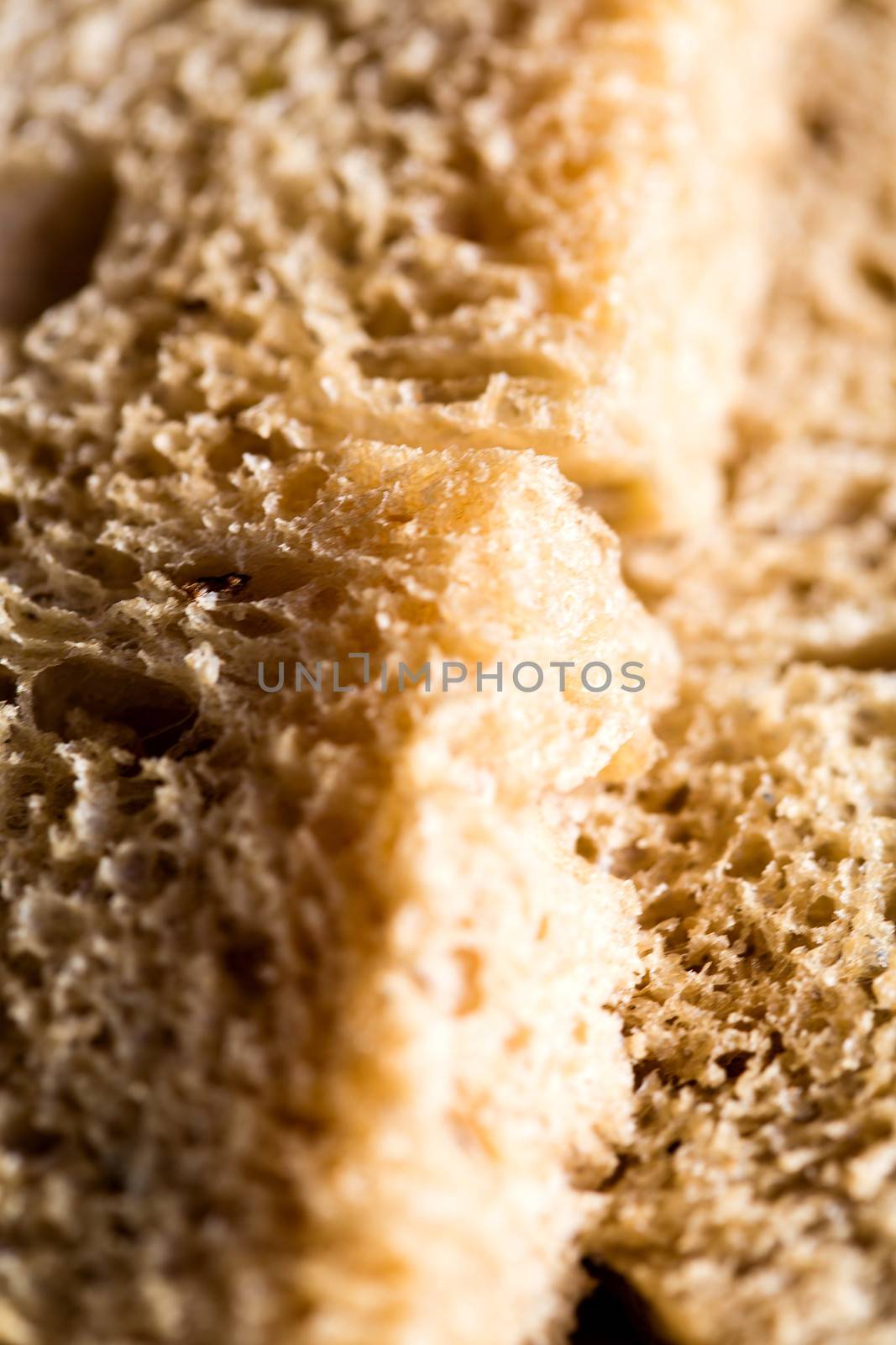 Closeup of a fresh wheat bread slice by stockyimages