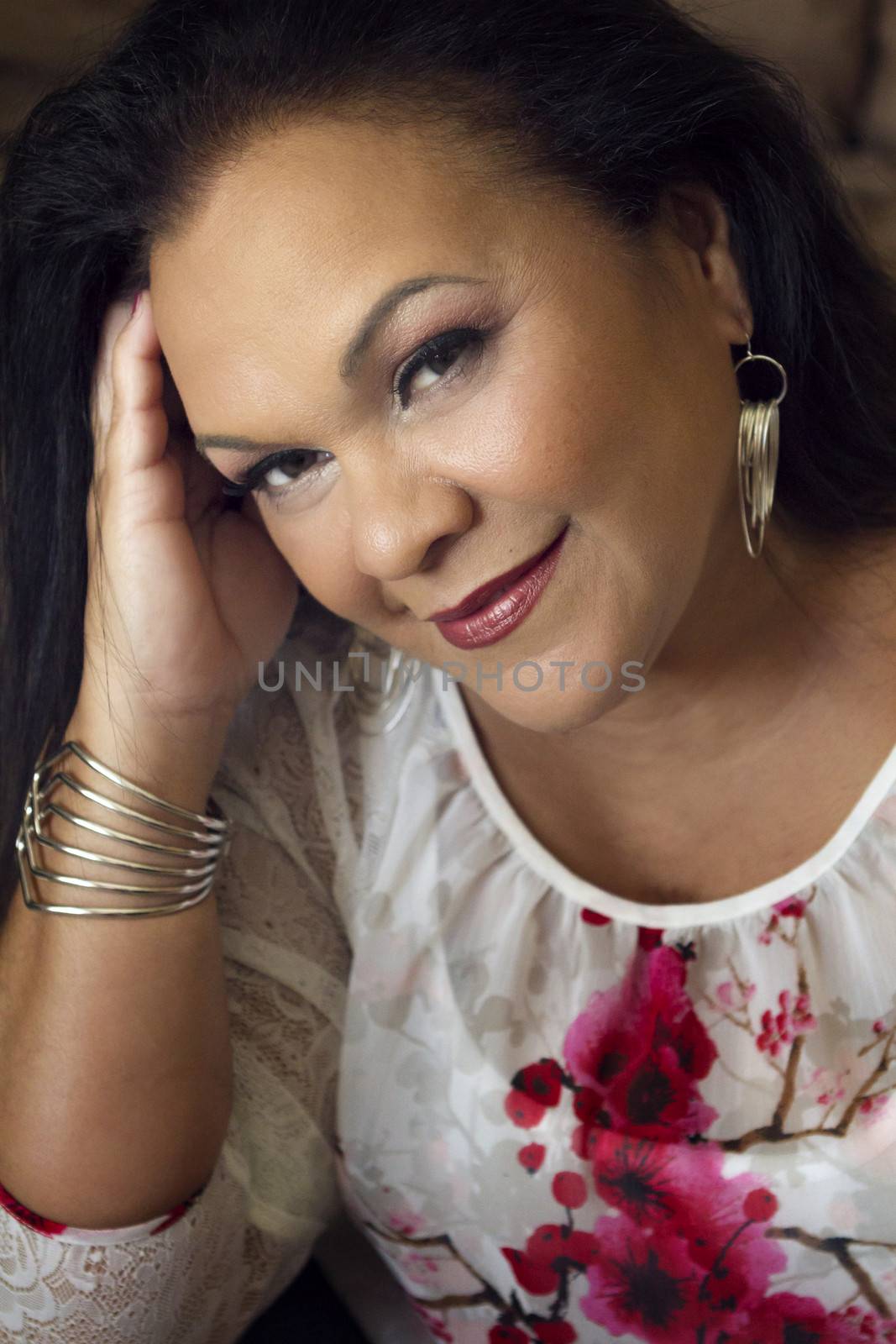 Close up portrait of a pretty hispanic woman in her 50s