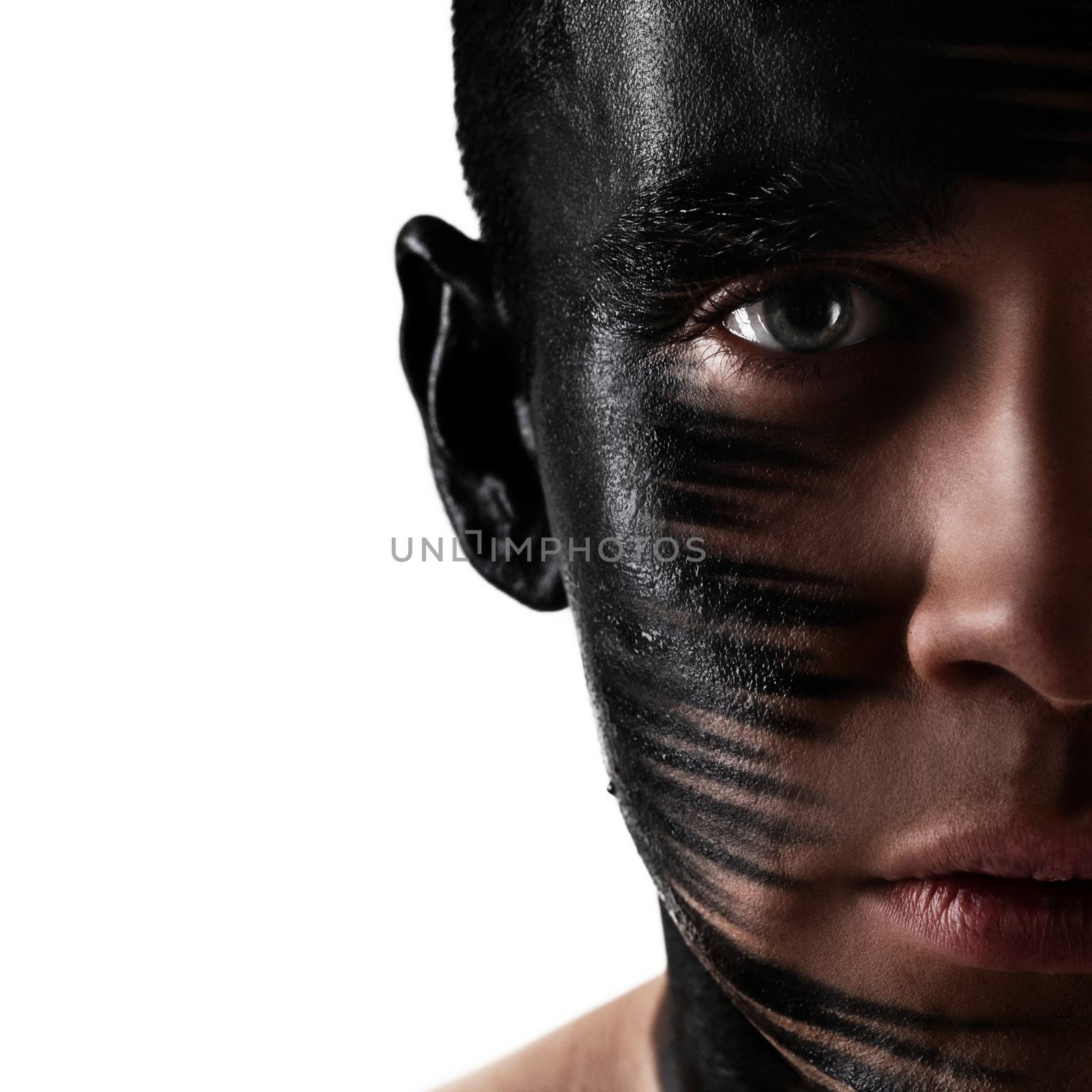 Handsome caucasian guy with artistic black shadow bodyart on his face
