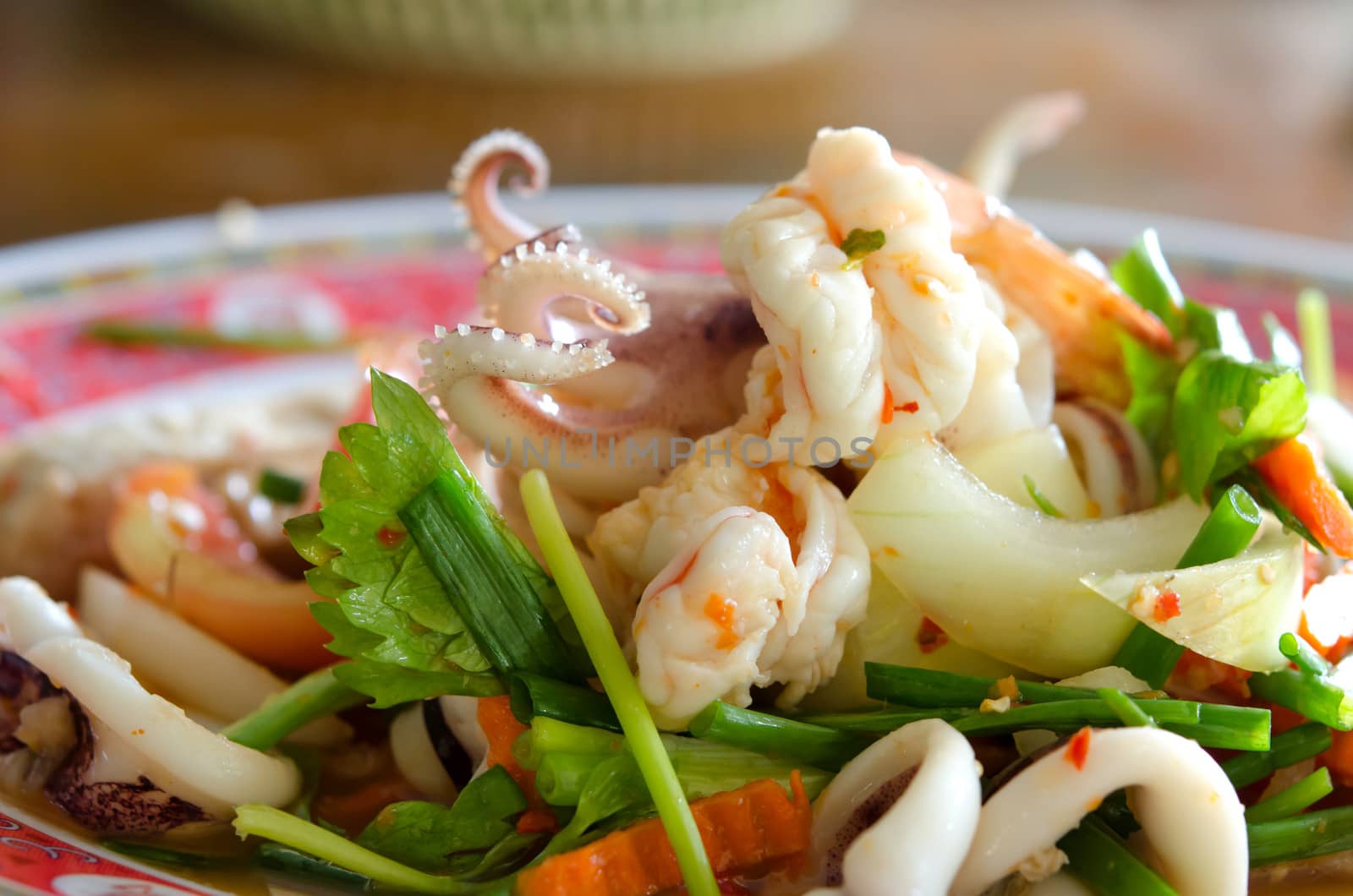 close up spicy mix salad with seafood  ,sausage and vegetable