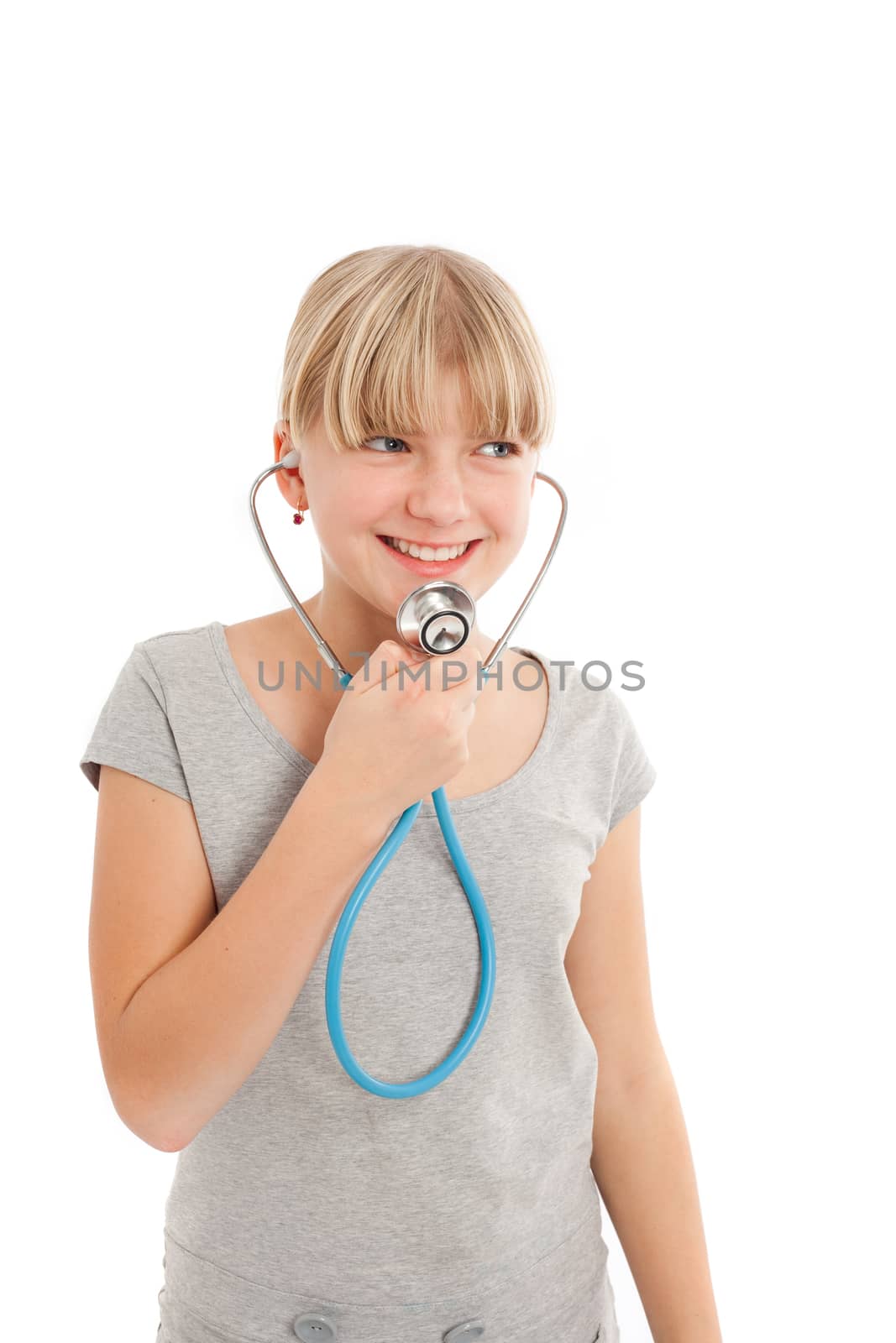 Young female speaking in a stethoscope. Isolated on white