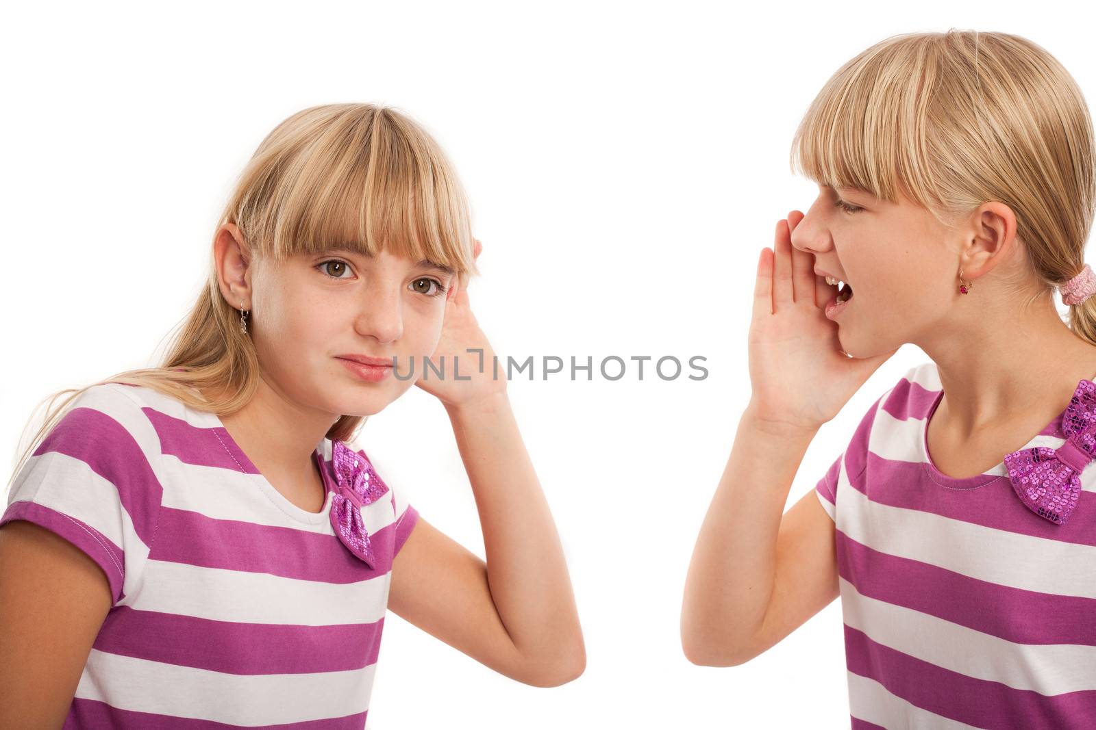 Hearing problems - Girl shouting to another girl who can't hear well. Isolated on white.