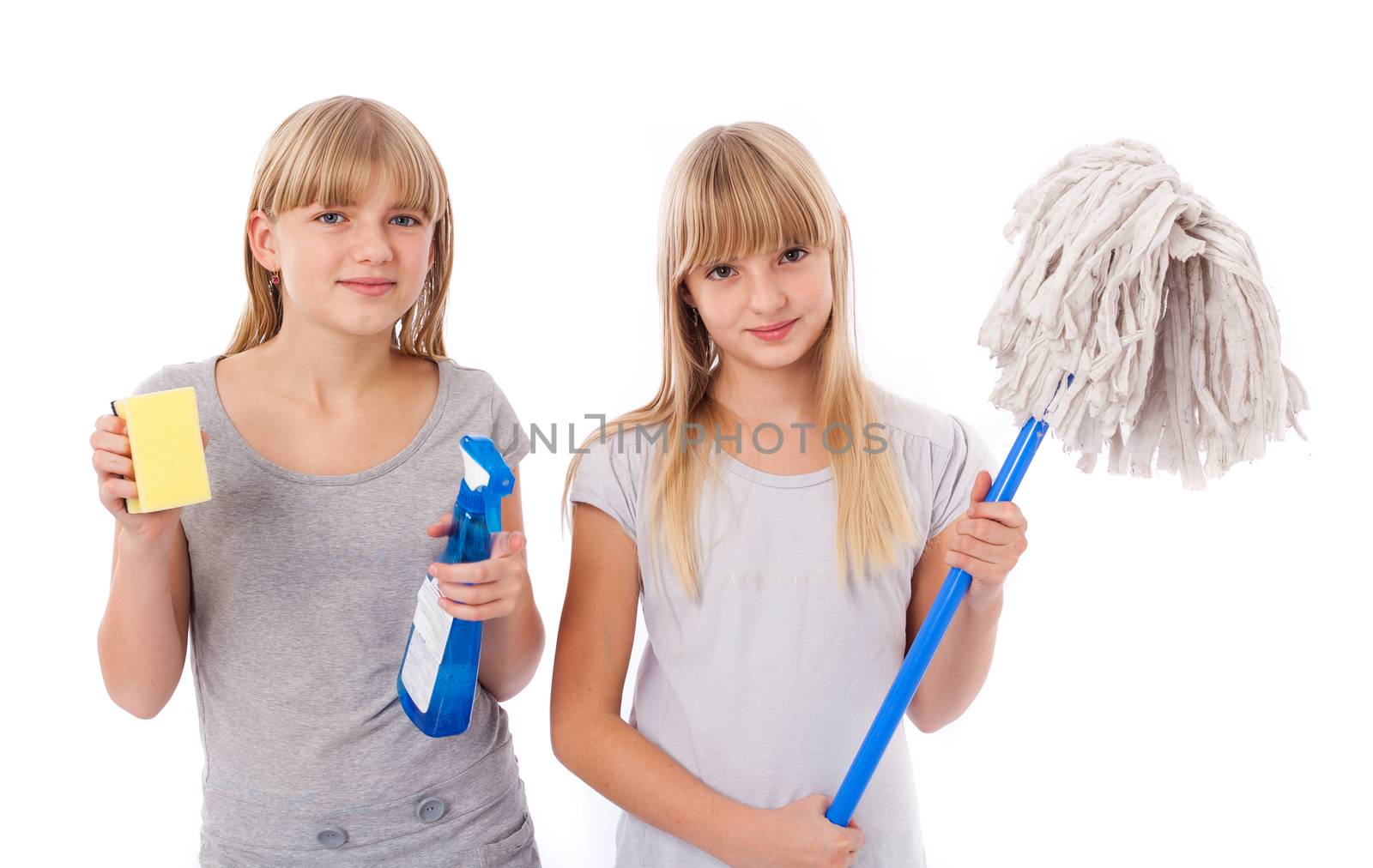 Housekeeping - Sisters showing cleaning utensils isolated on white