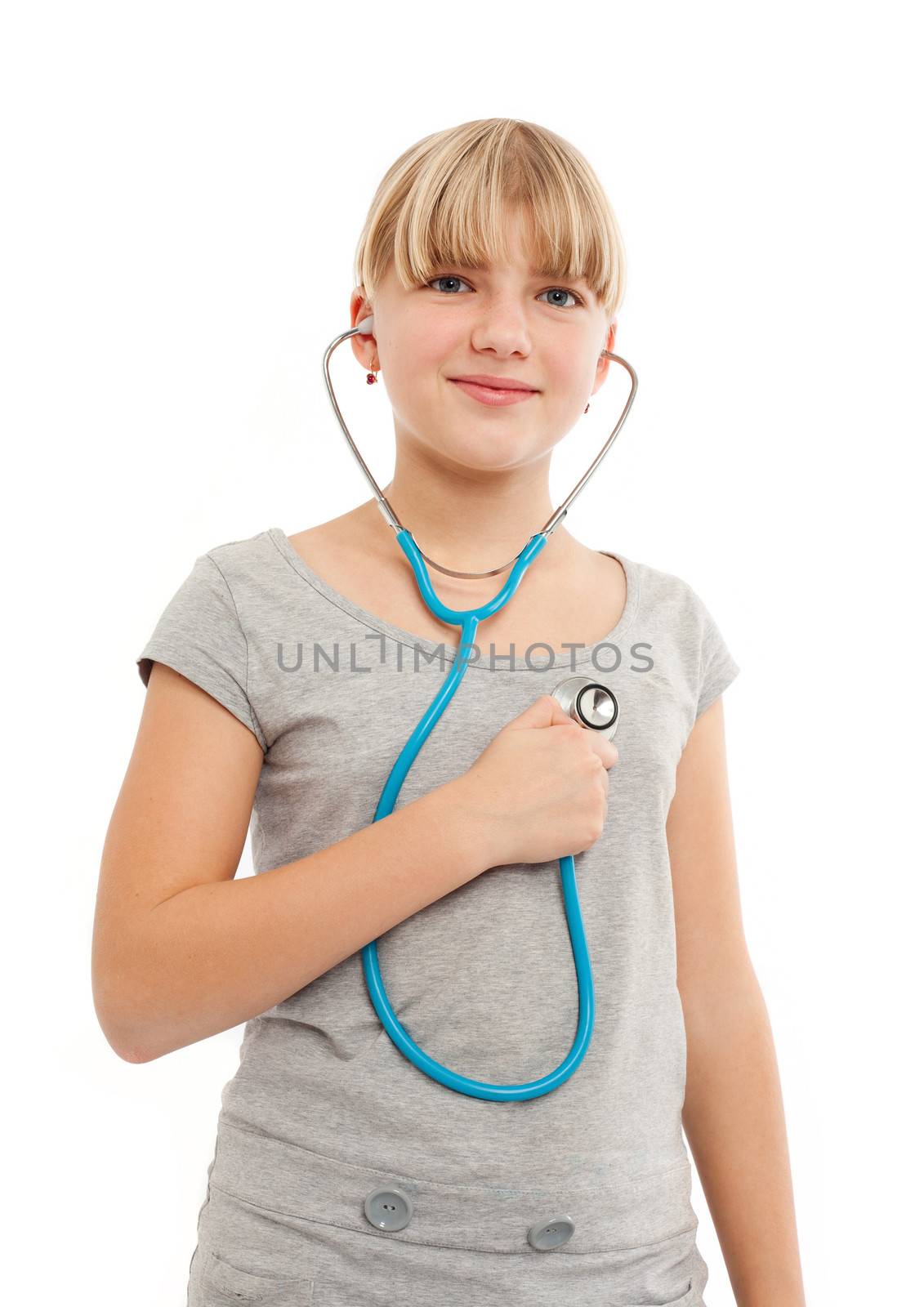 Self doctor - Young female checking herself wiht a stethoscope 