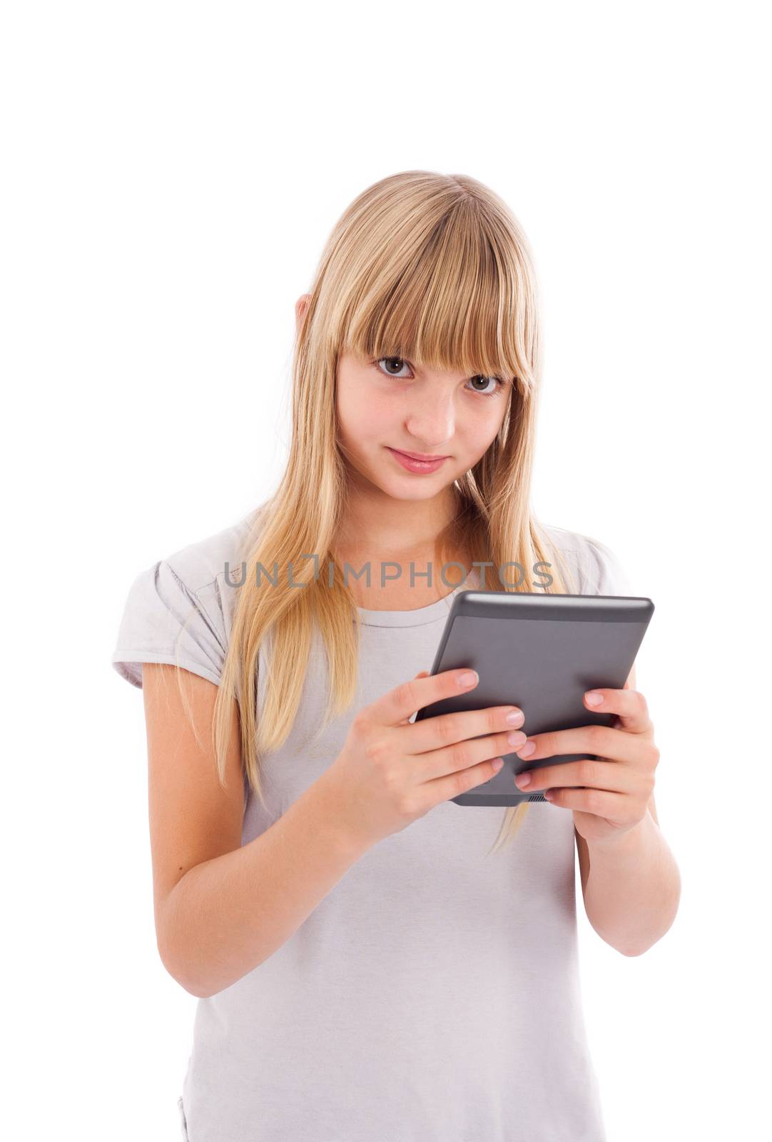 Young girl susing an ebook reader isolated on white