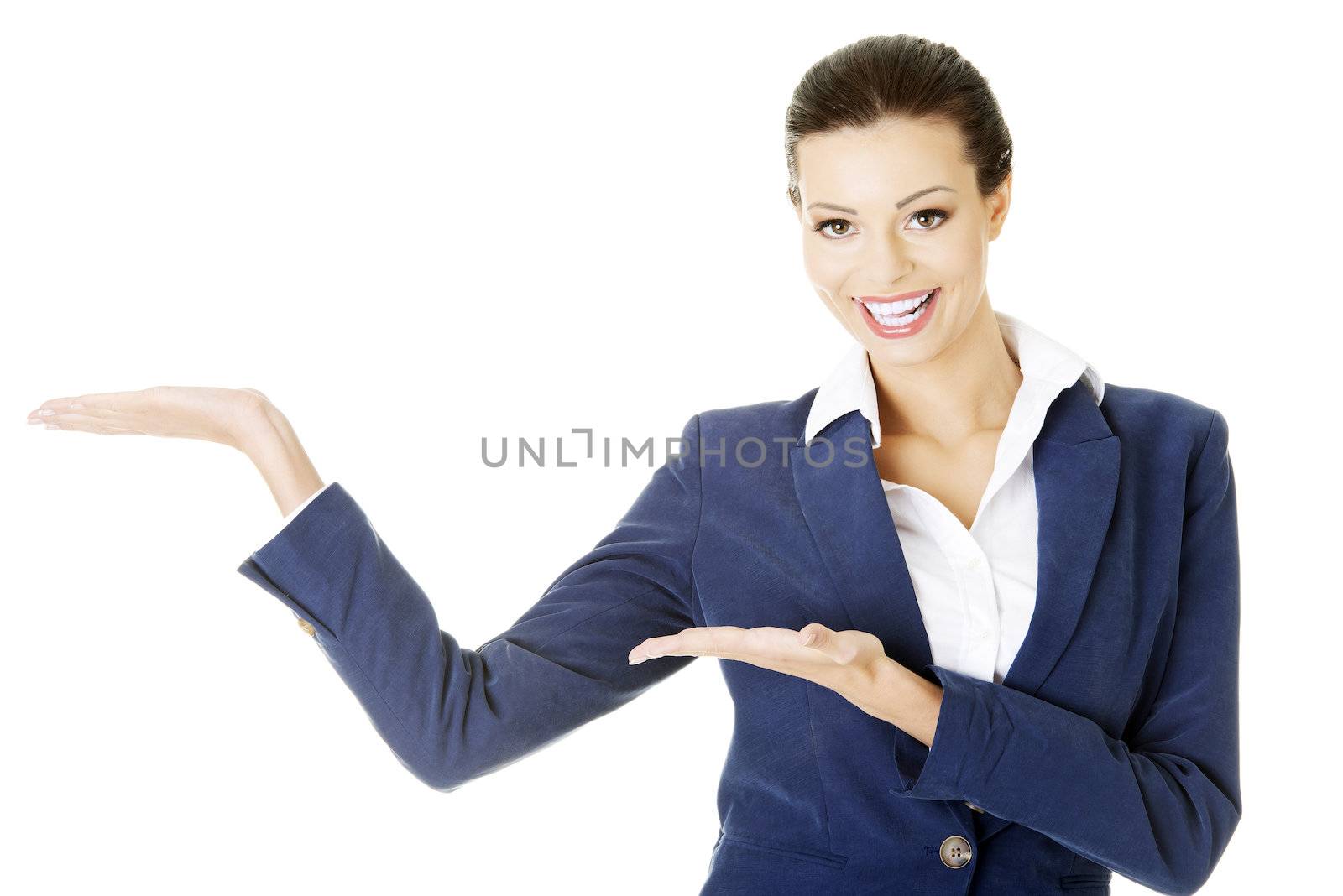 Happy young business woman showing copy space on her palm by BDS