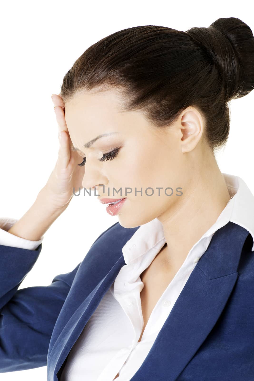 Businesswoman with a headache holding head, isolated on white background