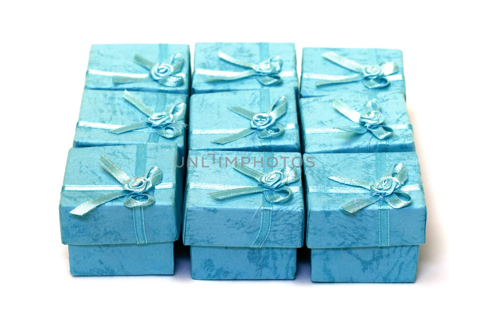Cyan gift boxes closeup on white background