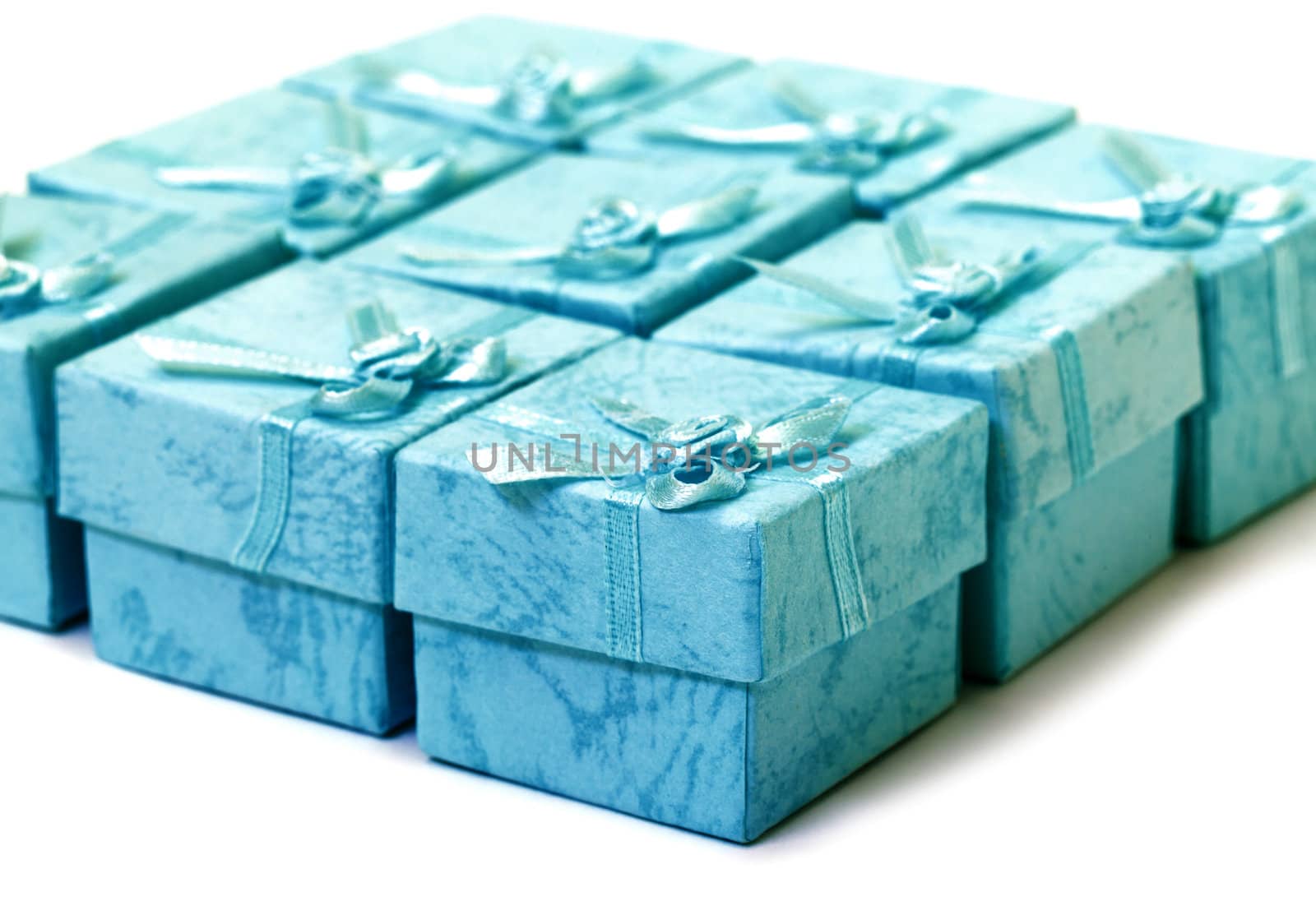 Cyan gift boxes closeup on white background