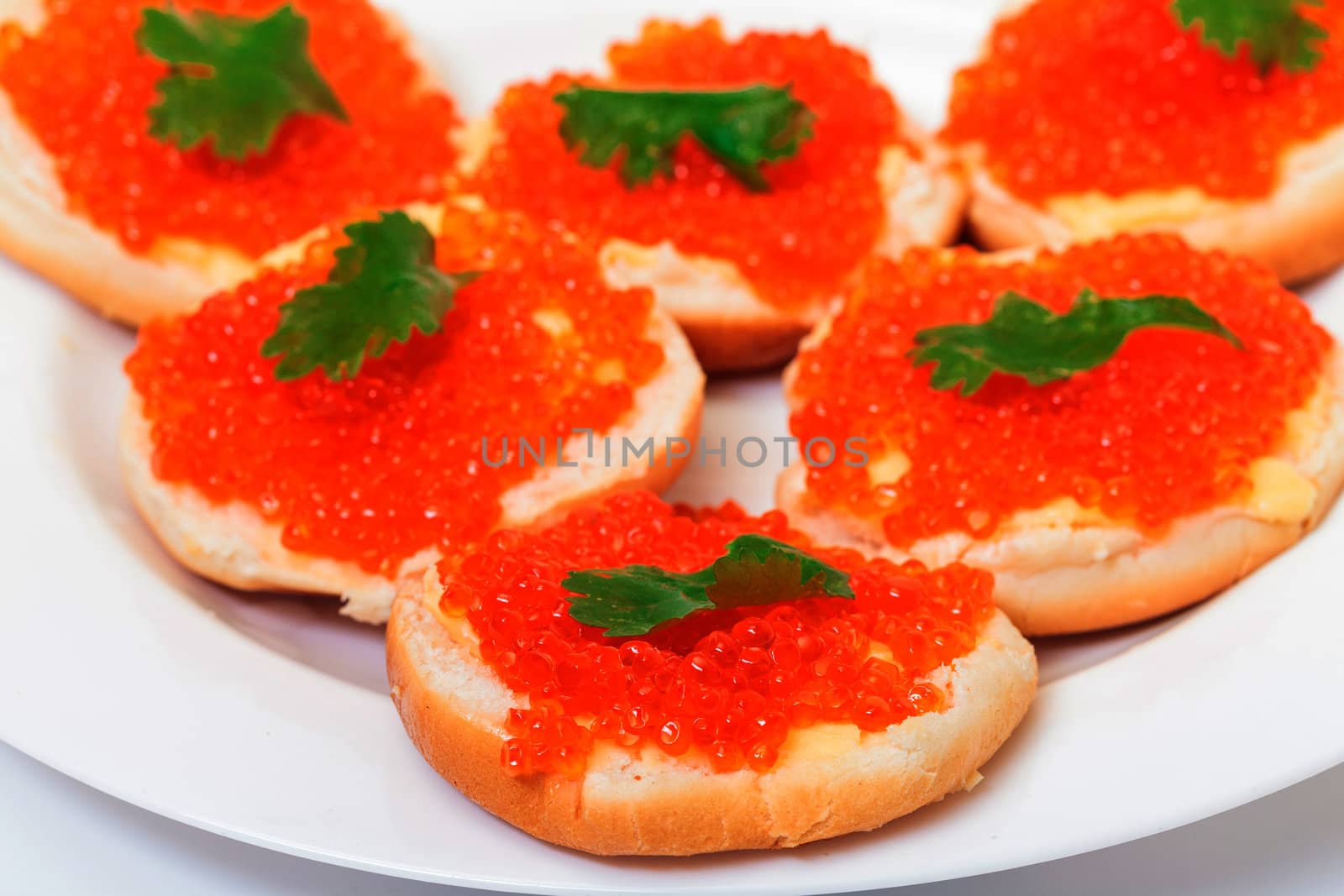 Sandwiches with red salted caviar by Discovod