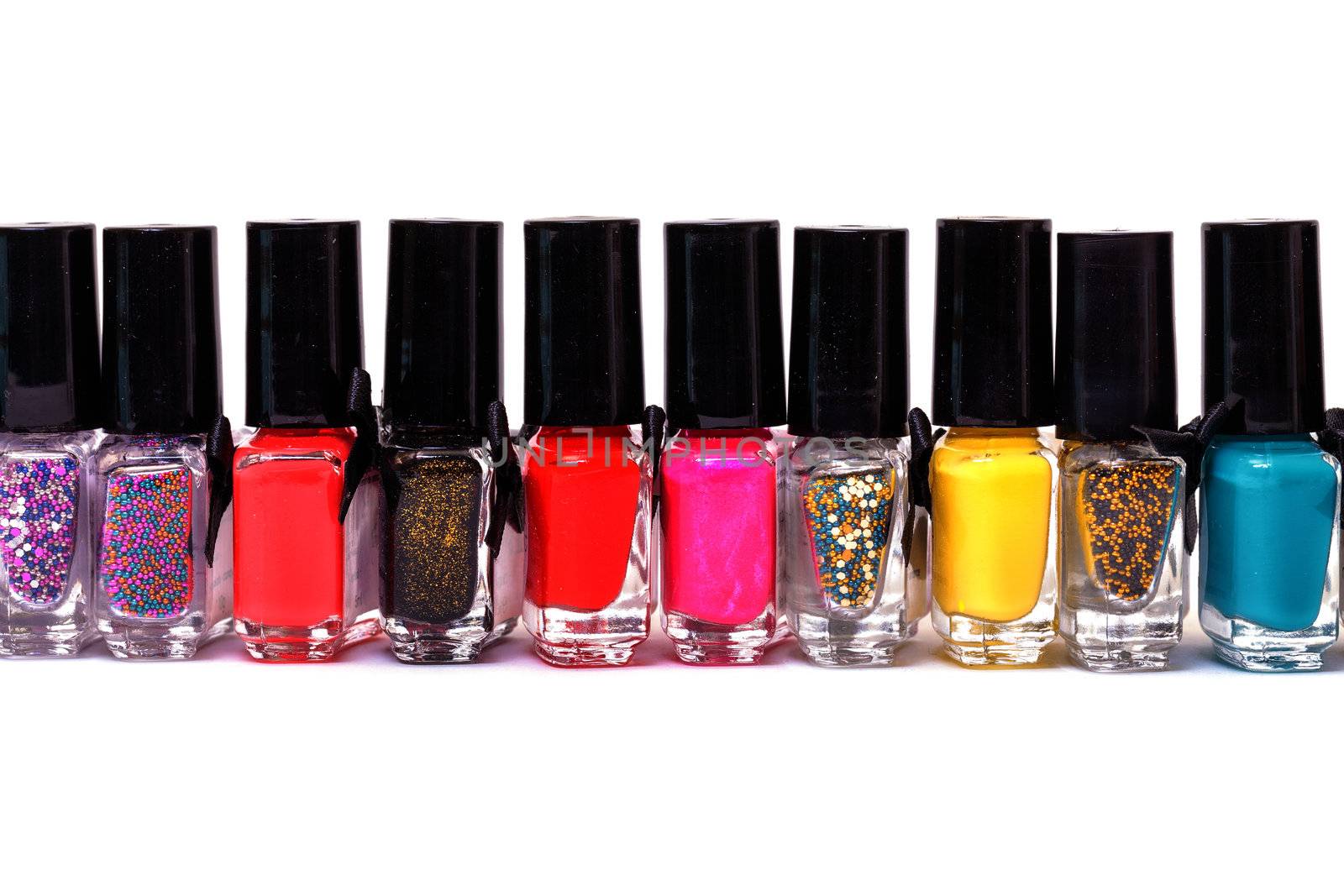 Group of bright nail polishes by Discovod