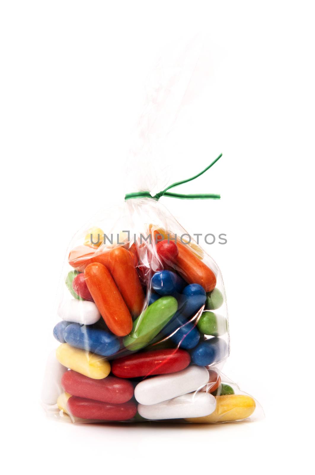 candy of many shapes and colors on white background