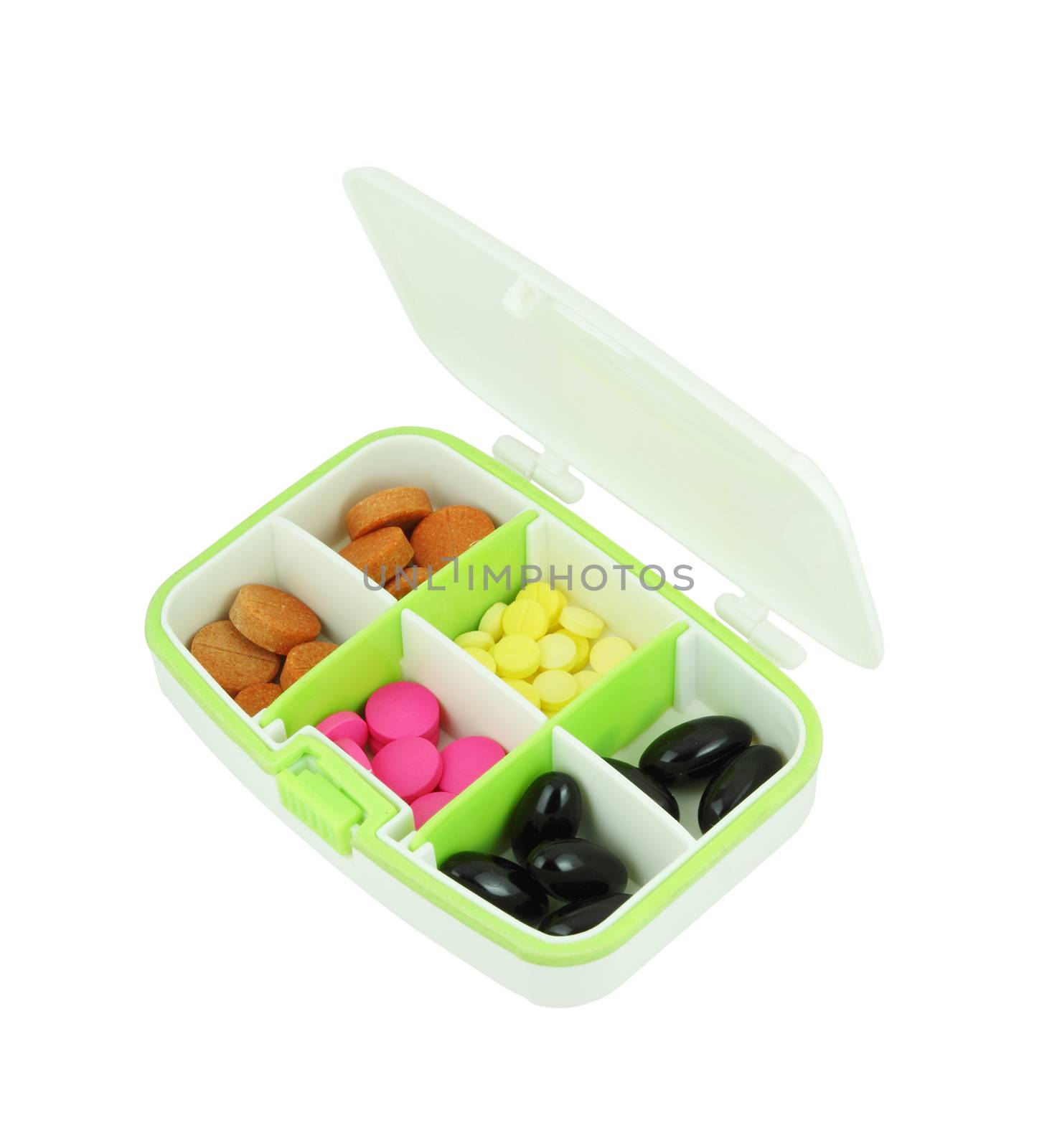 pills in pill box on white background