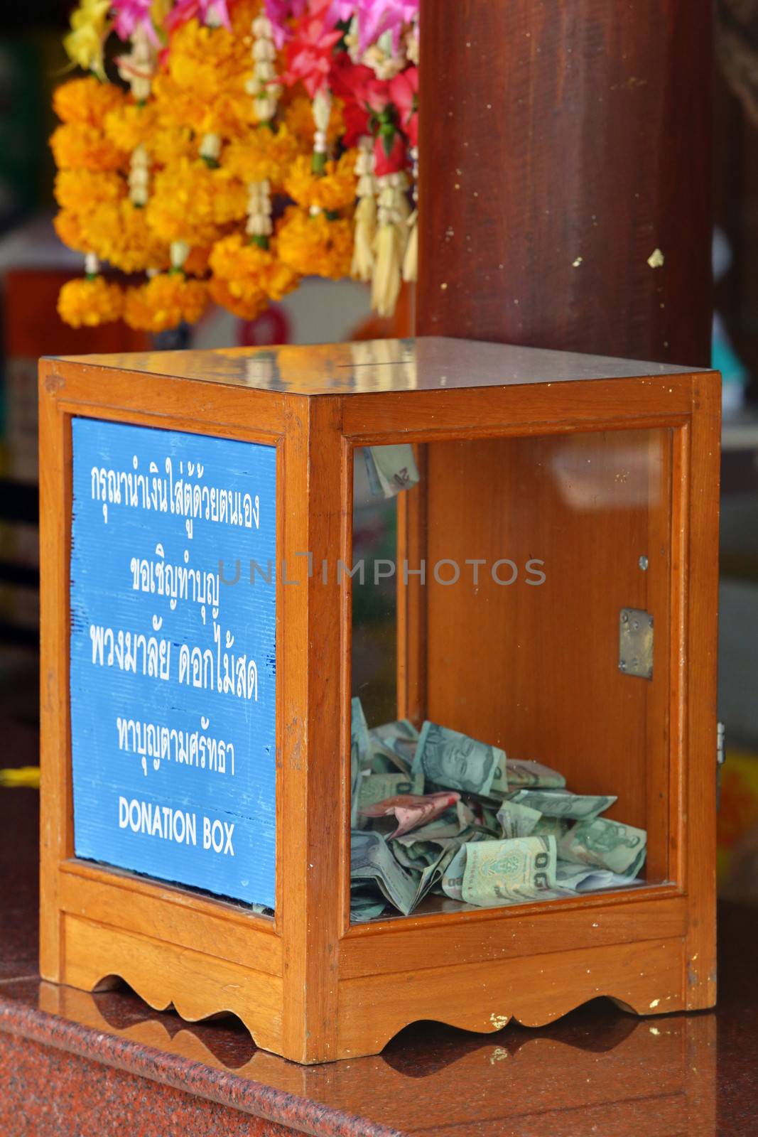 Donation Box with Thai Baht Banknote