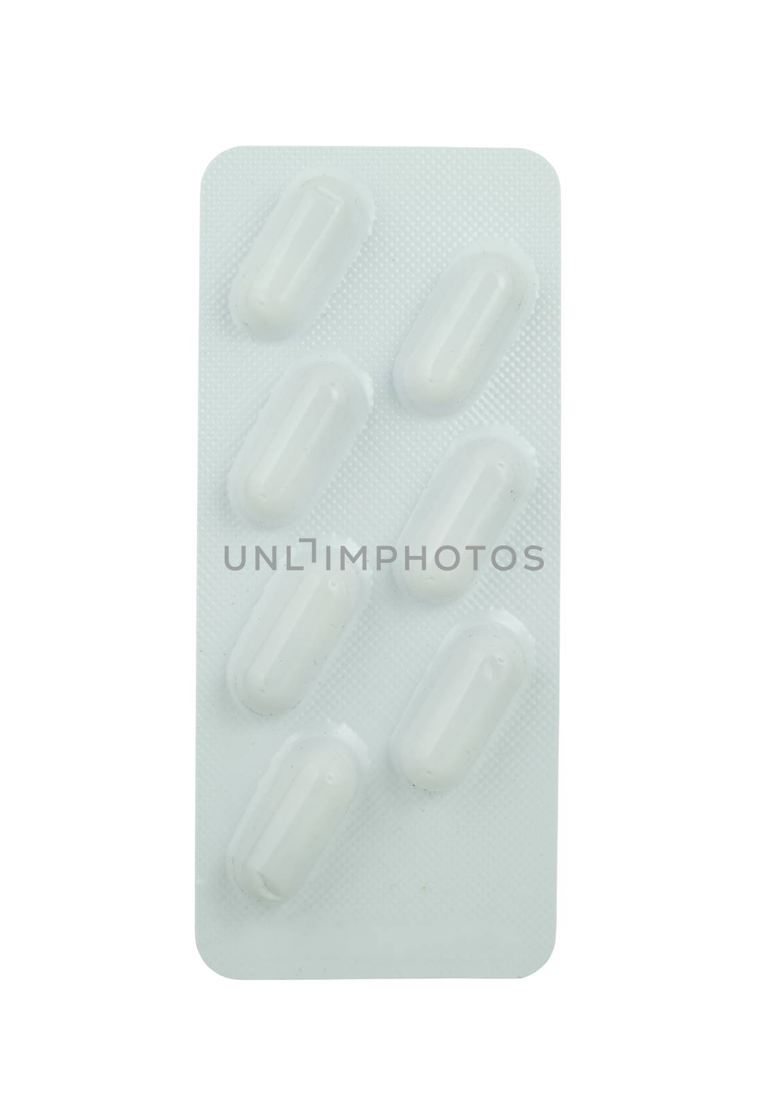 Capsules packed in blister on white background