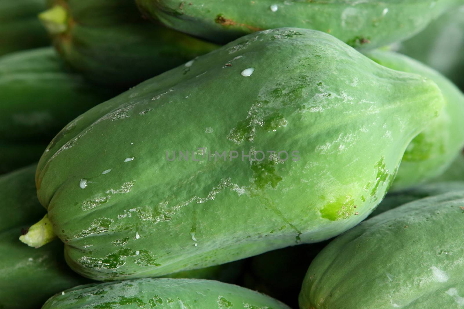 Green papaya sale in market of Thailand