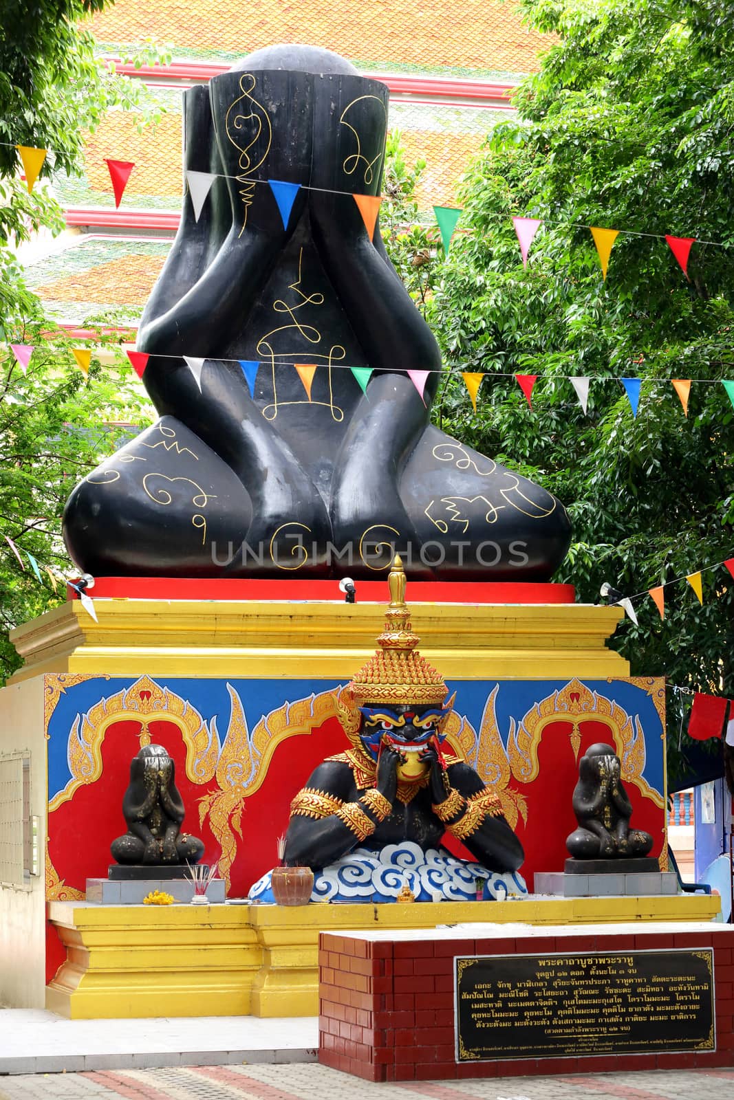 Phra Pidta (closed eyes buddha) and Phra Rahu at Thai temple