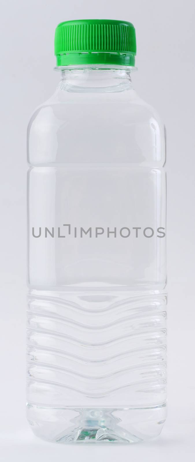 Drinking water in clear bottle isolated on white