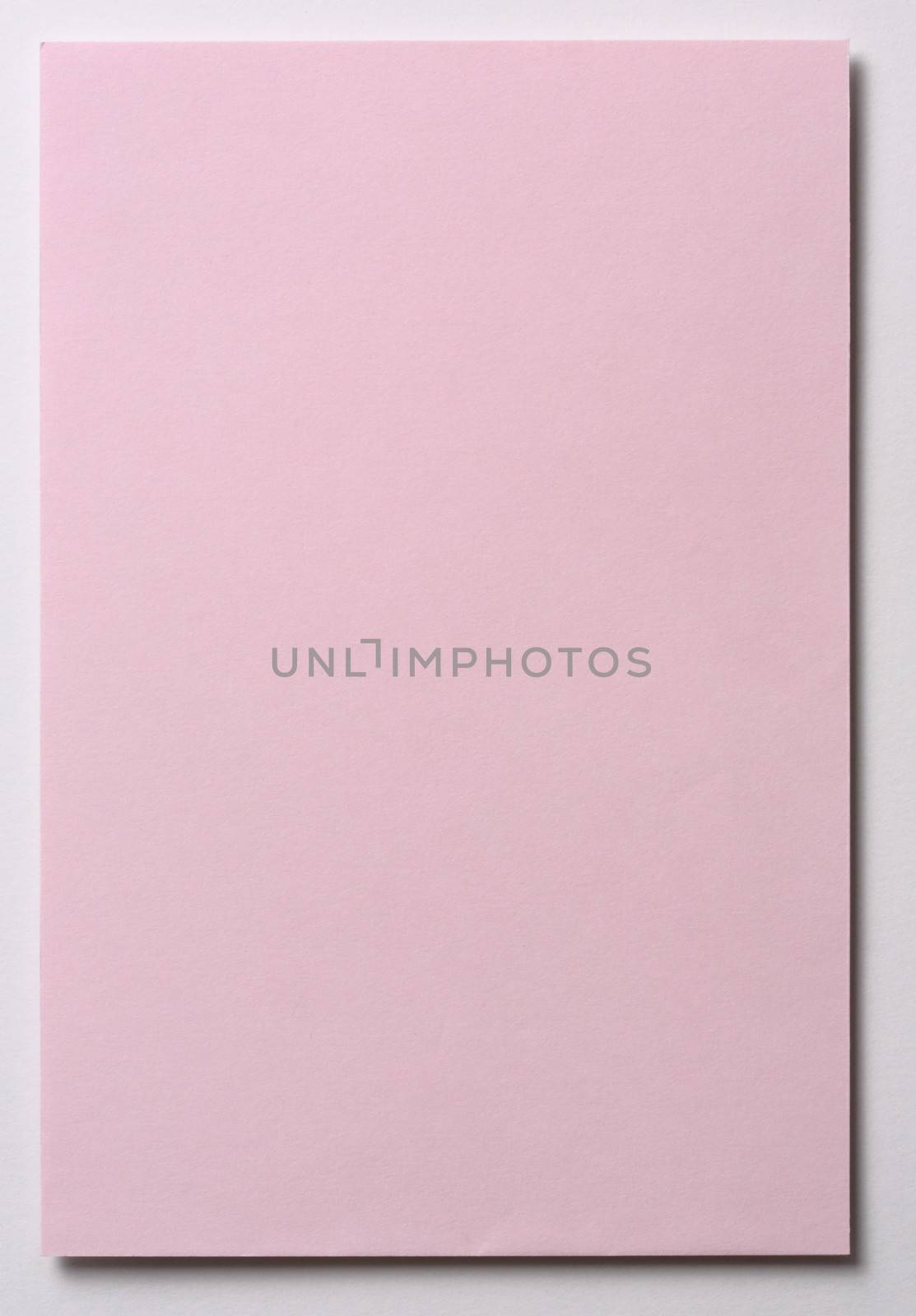 Light pink note paper isolated on white