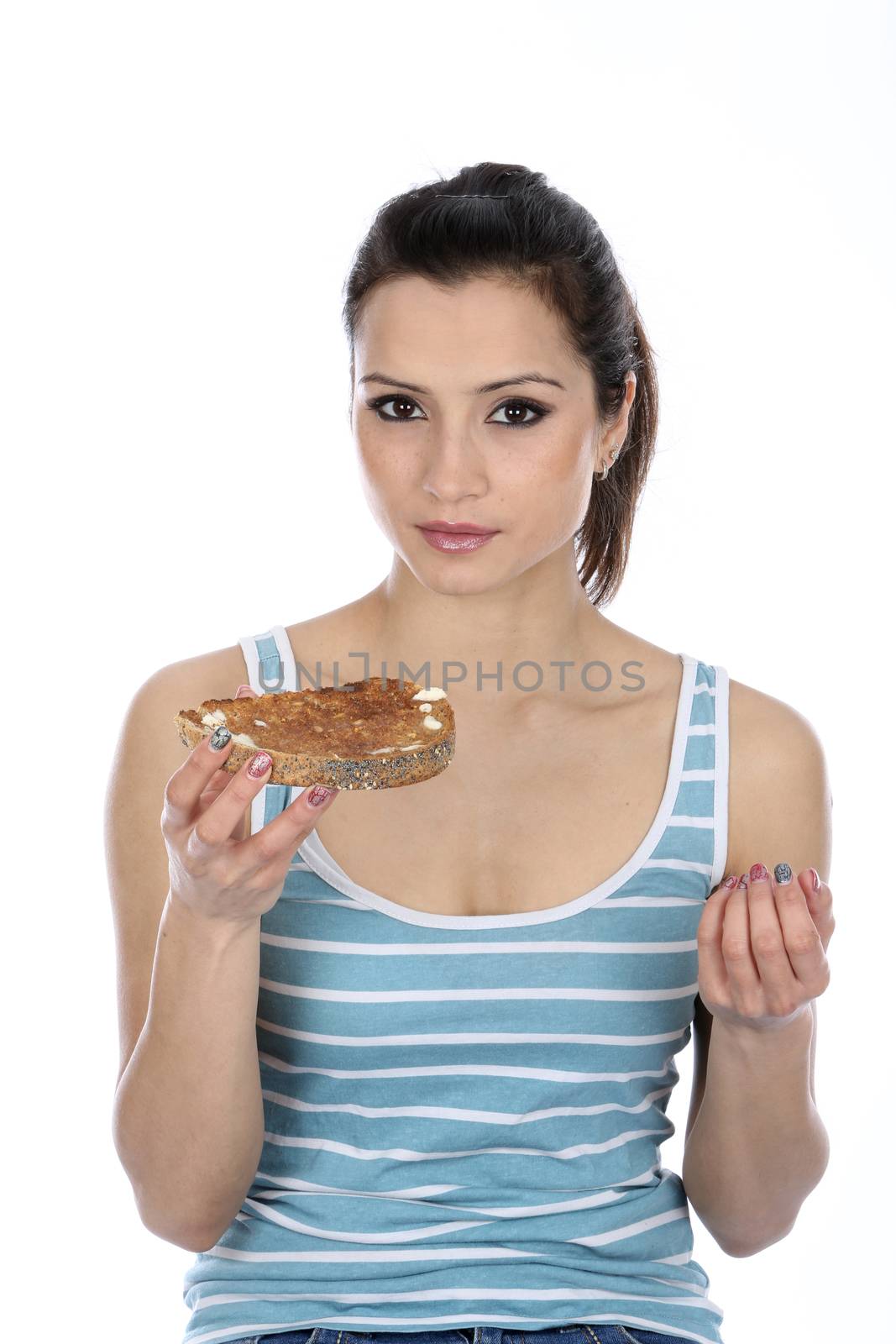 Model Released. Woman Eating Buttered Toast