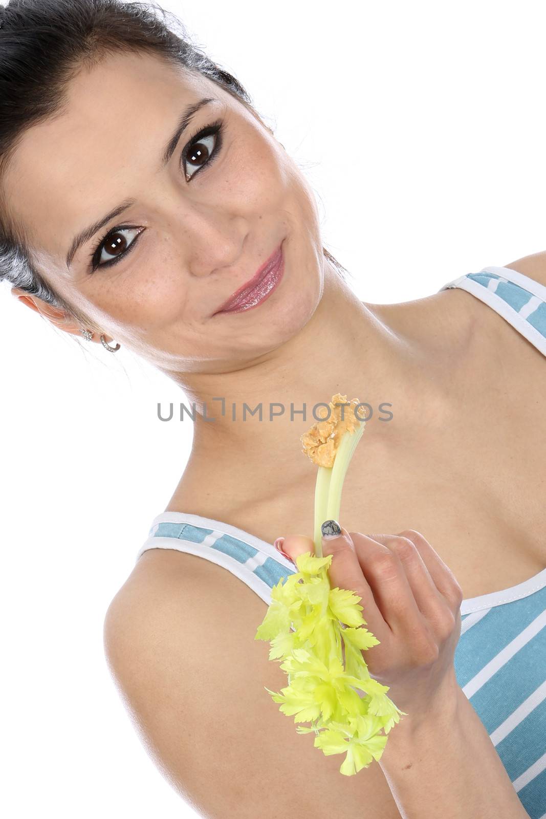 Model Released. Woman Eating Celery and Peanut Butter