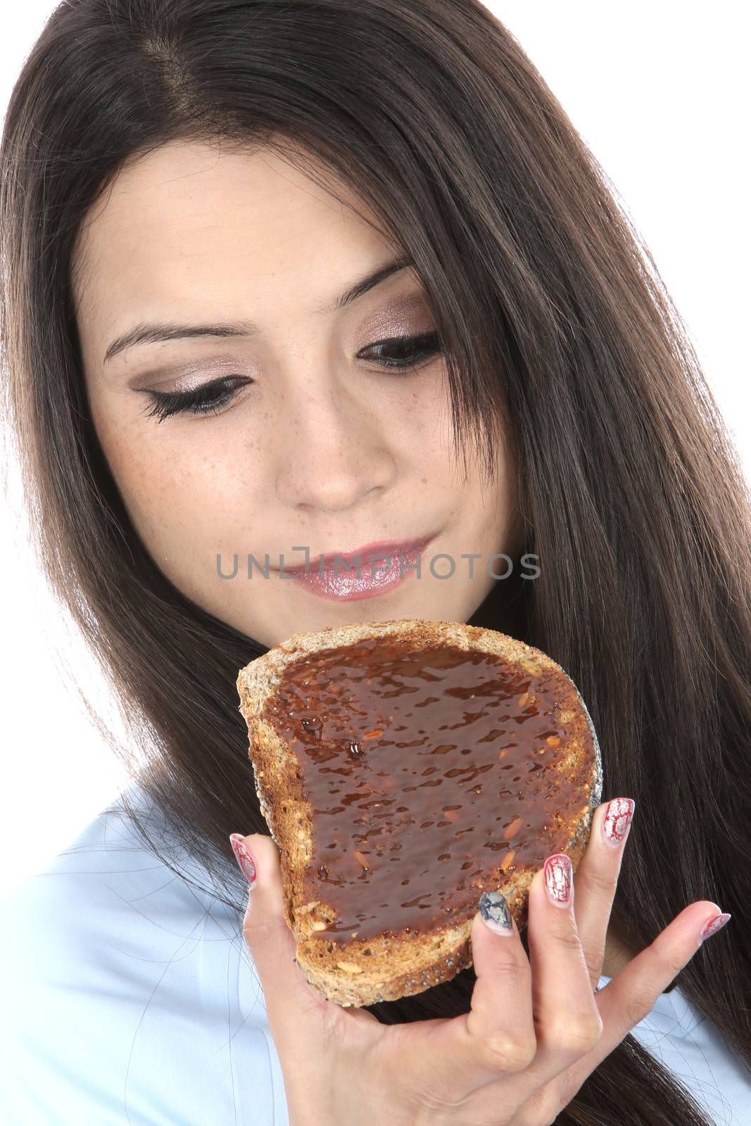 Model Released. Woman Eating Marmite on Toast