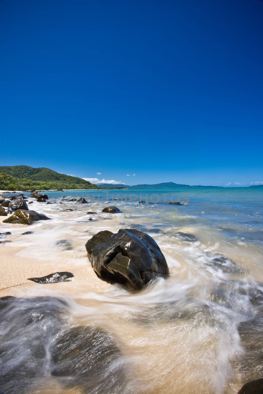 Landscape rocky seashore over the bright blue sky