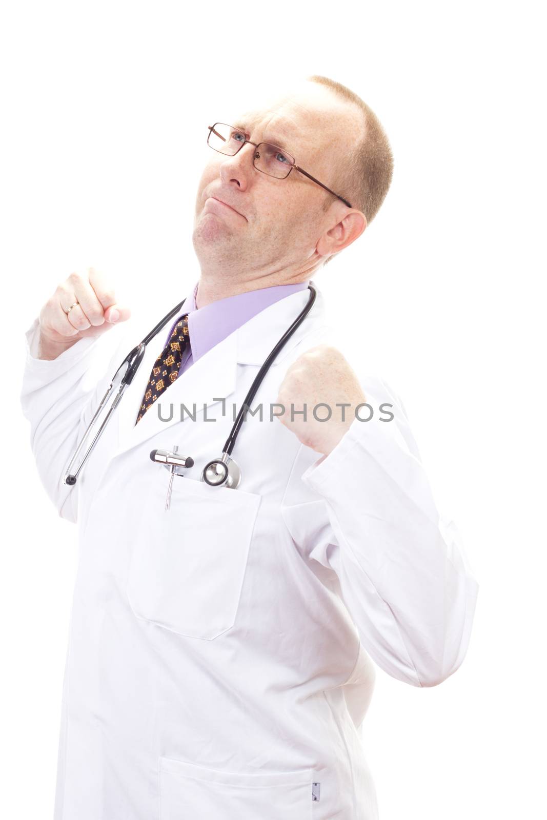 Male medical doctor stretching his back after long period of work