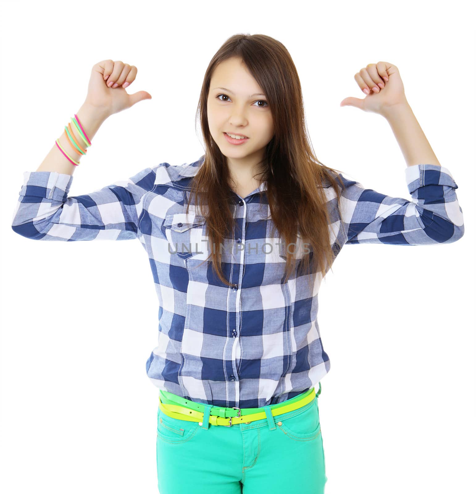 Young teen girl pointing behind with her thumb. Young woman in a plaid shirt points a two finger behind his back. by grigvovan