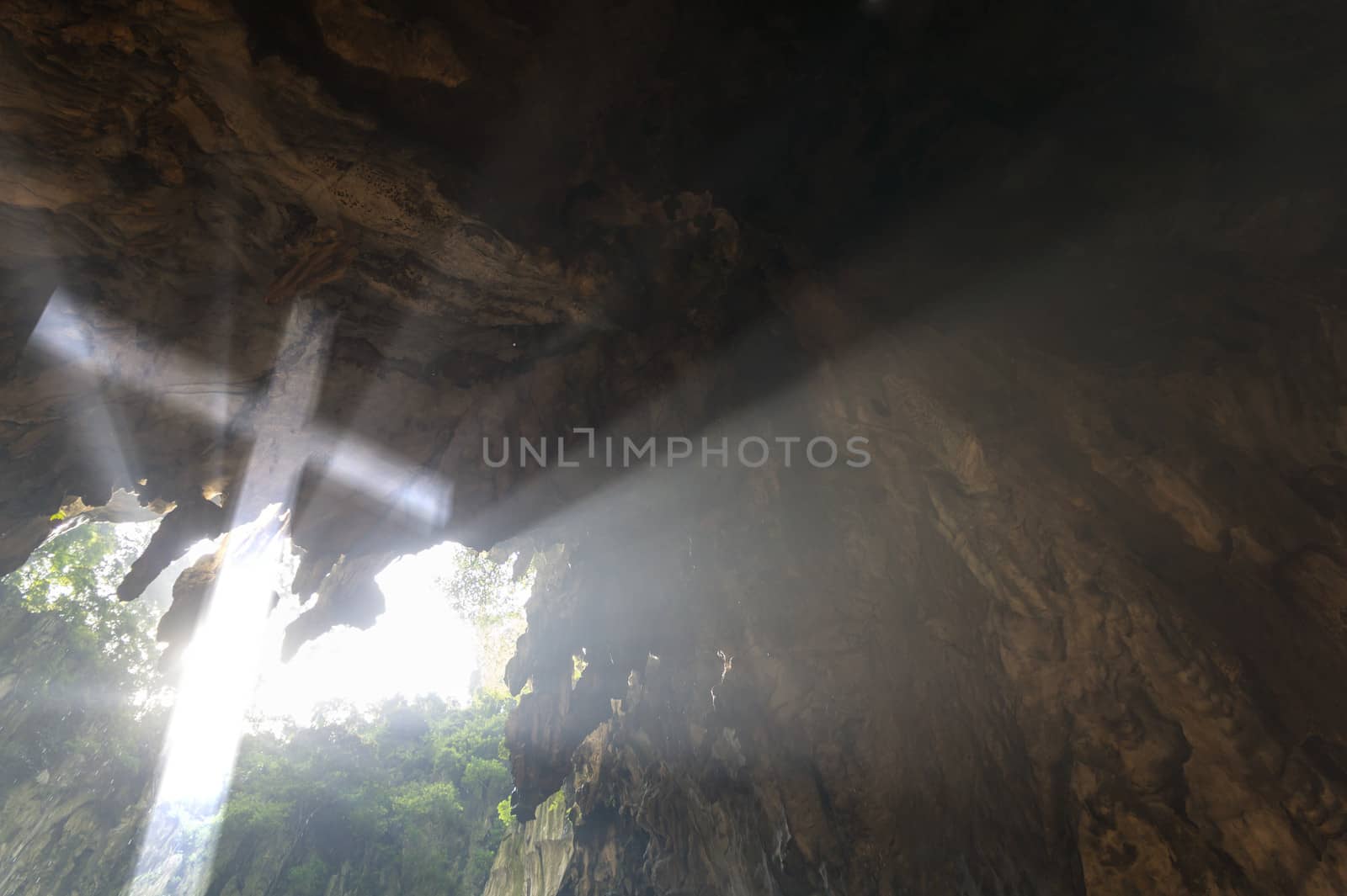 An illusional Christian Cross appear inside a cave.