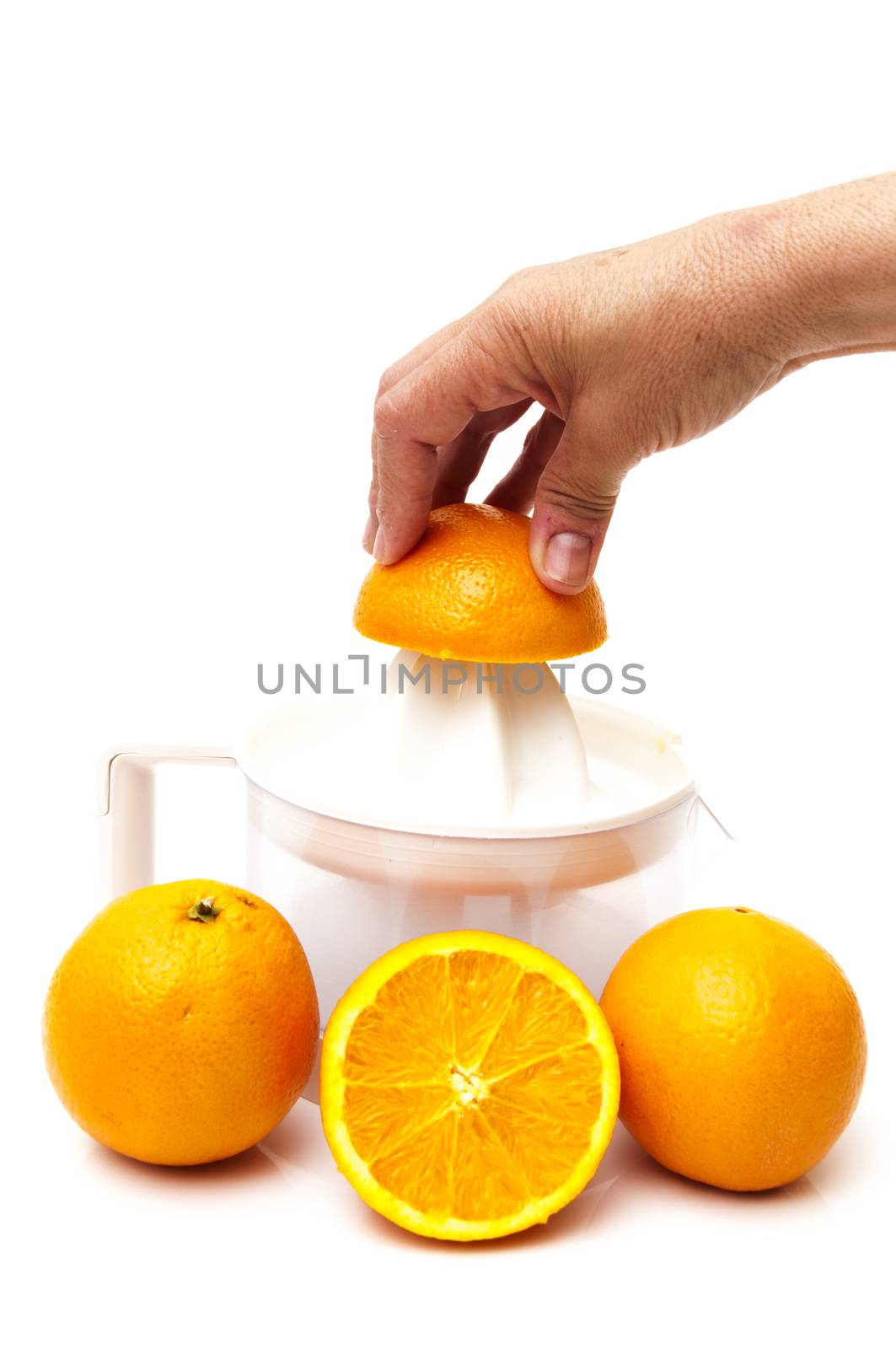 juicer with oranges on a white background