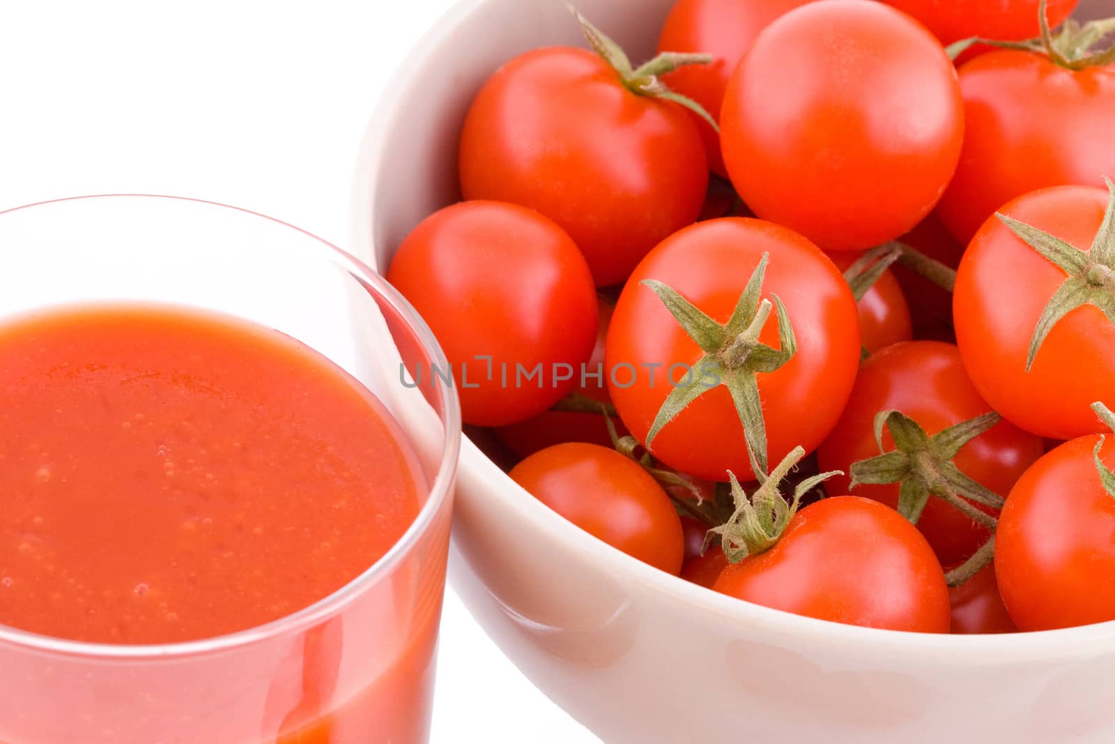 Small tomatoes and cocktail isolated on white