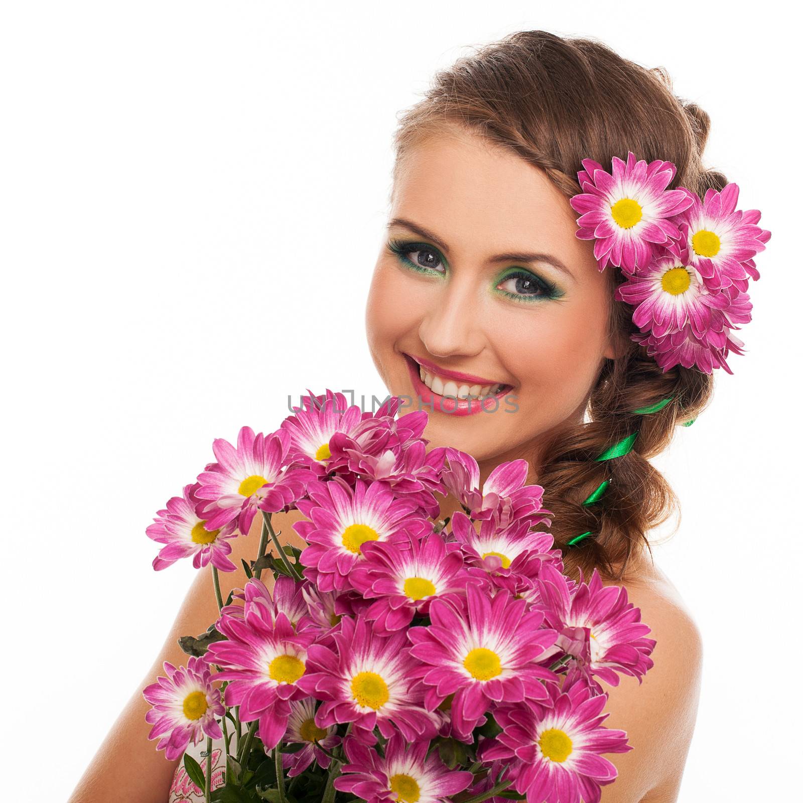 Young beautiful woman with flowers in her hair and expressive makeup