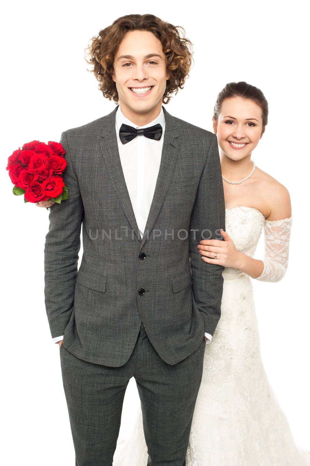 Studio shot of a newlywed couple by stockyimages
