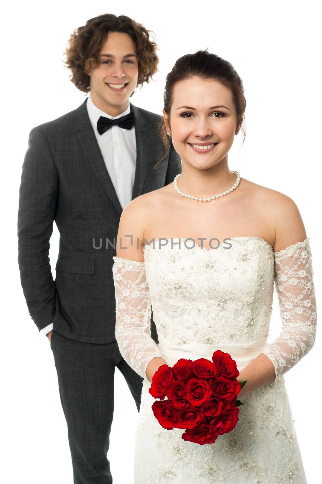 Fashion shot a handsome groom and lovely wife by stockyimages