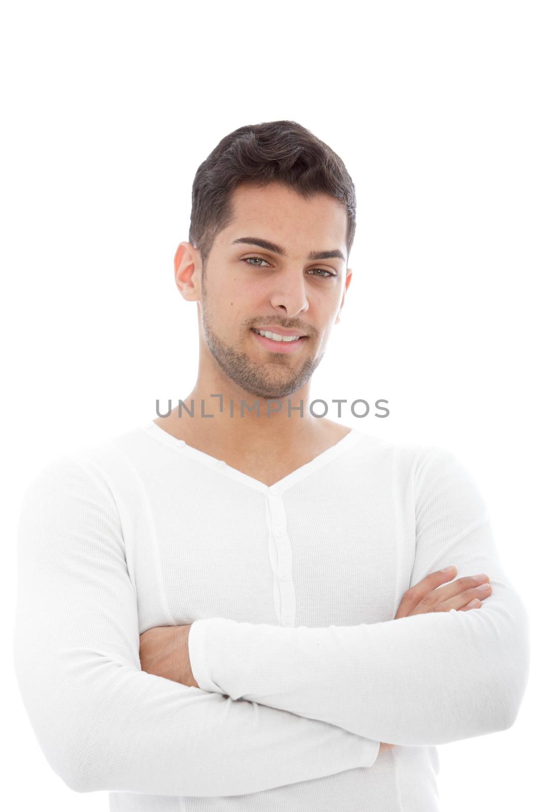 Portrait of young handsome male posing with arms crossed