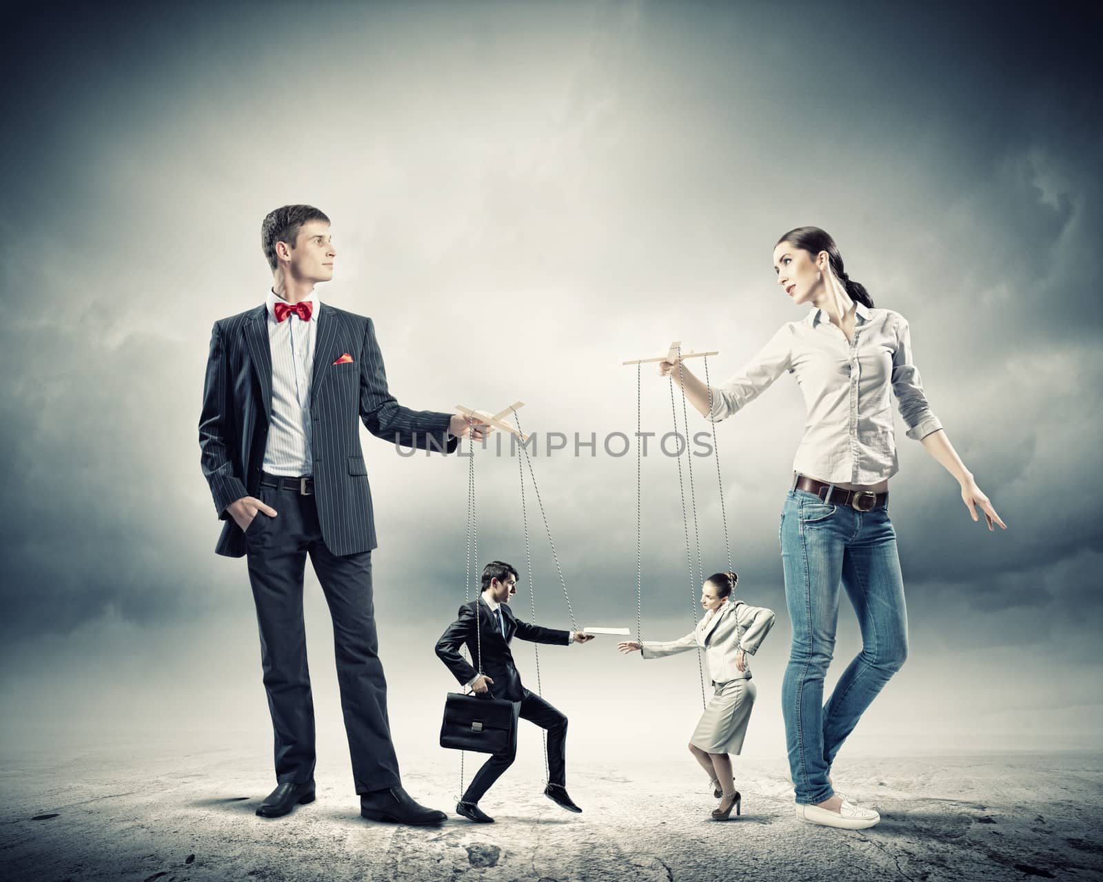 Image of man and woman with marionette puppets